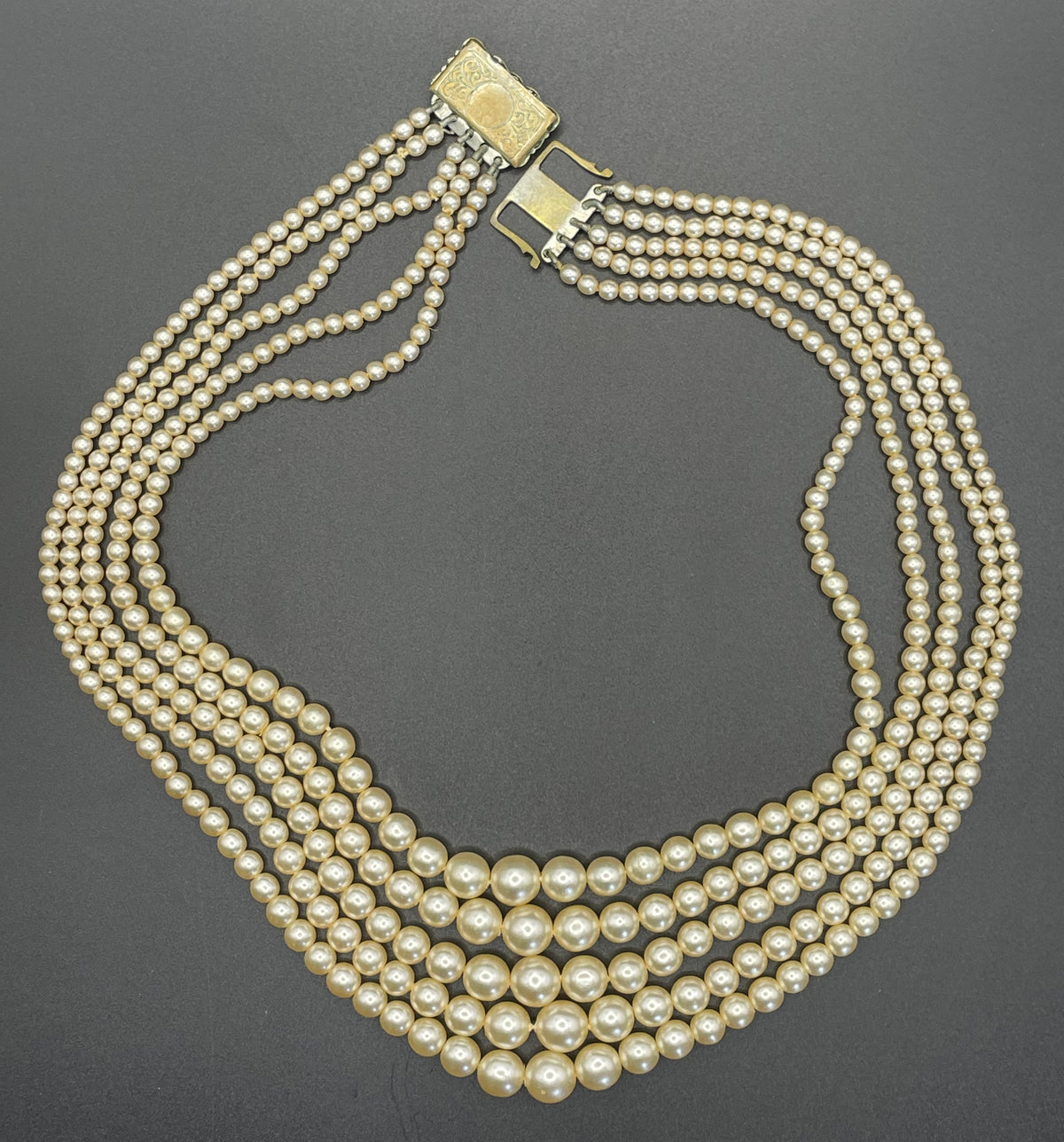 Vintage five strand glass faux pearl necklace with ornate clear rhinestone box clasp, graduated glass pearls