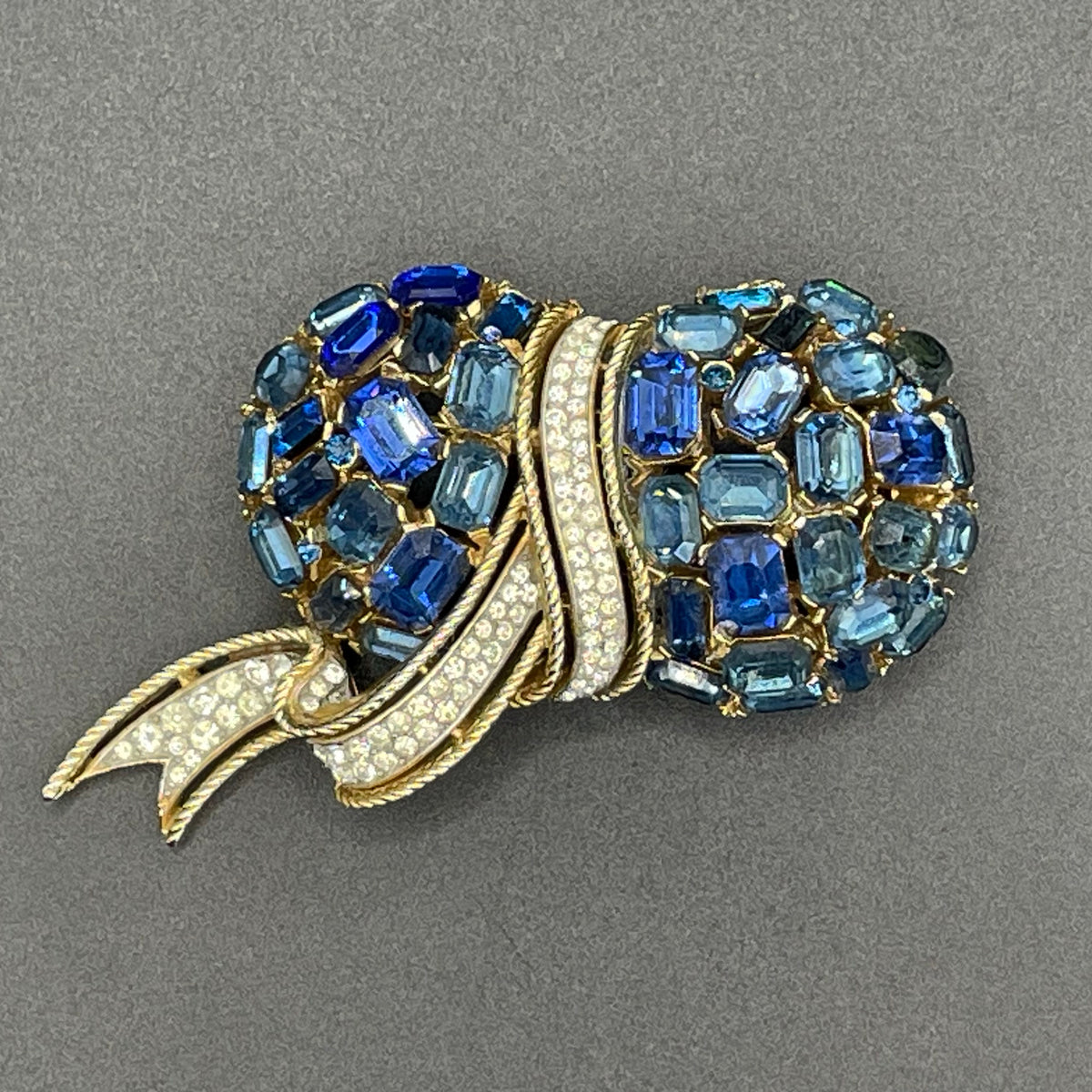 Vintage signed Trifari blue and clear rhinestone brooch in gold tone, a heavy, good quality example