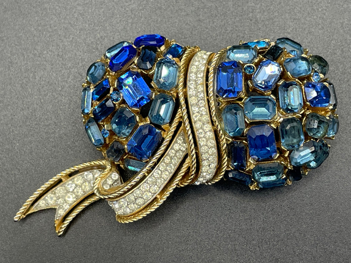 Vintage signed Trifari blue and clear rhinestone brooch in gold tone, a heavy, good quality example