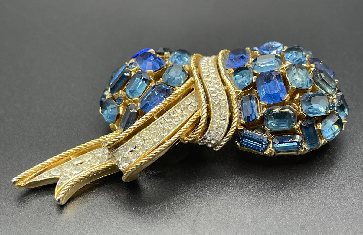 Vintage signed Trifari blue and clear rhinestone brooch in gold tone, a heavy, good quality example