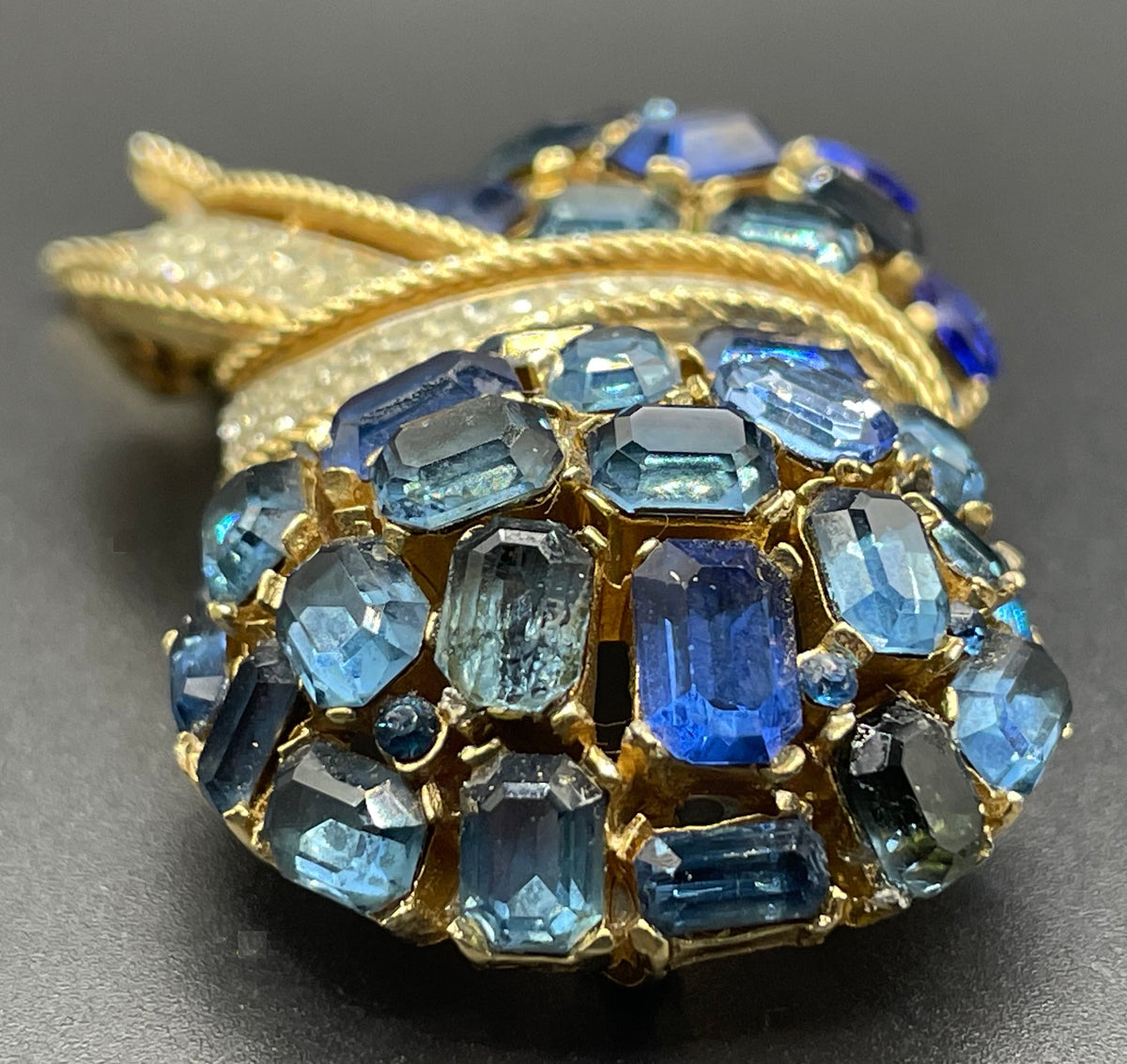 Vintage signed Trifari blue and clear rhinestone brooch in gold tone, a heavy, good quality example