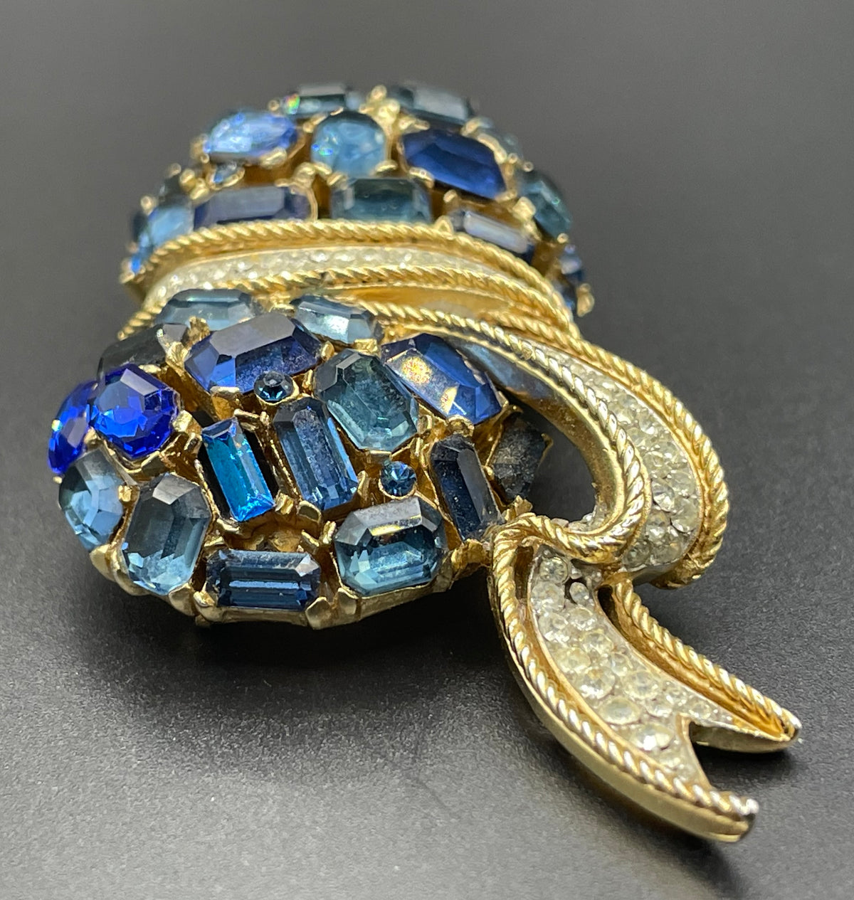 Vintage signed Trifari blue and clear rhinestone brooch in gold tone, a heavy, good quality example