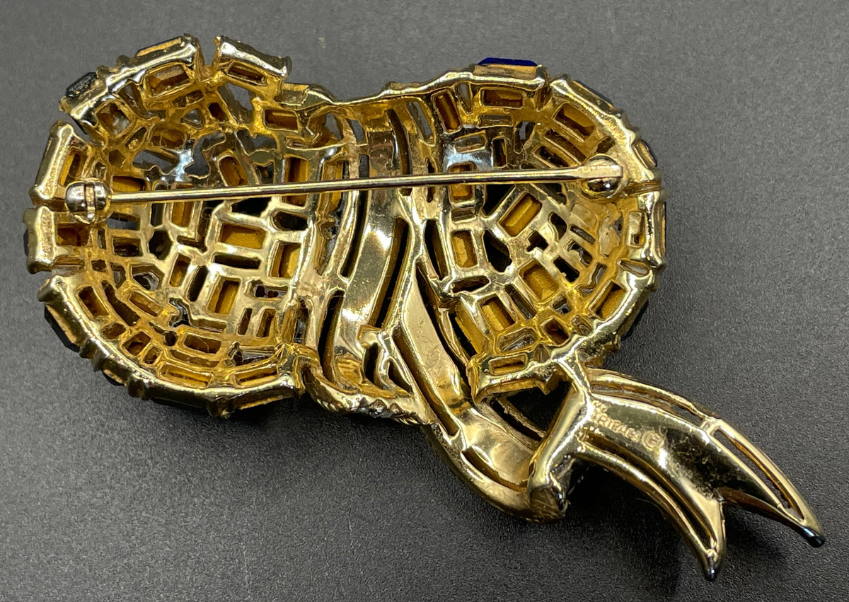 Vintage signed Trifari blue and clear rhinestone brooch in gold tone, a heavy, good quality example