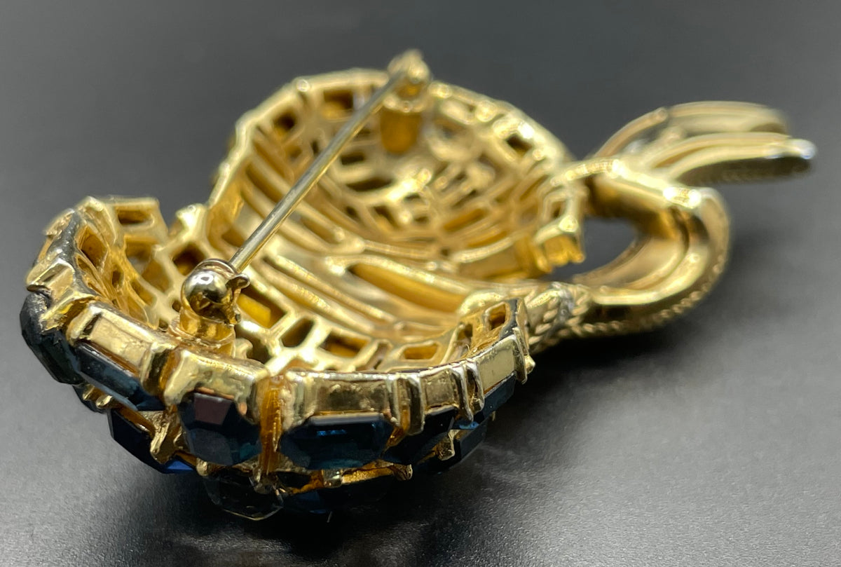 Vintage signed Trifari blue and clear rhinestone brooch in gold tone, a heavy, good quality example