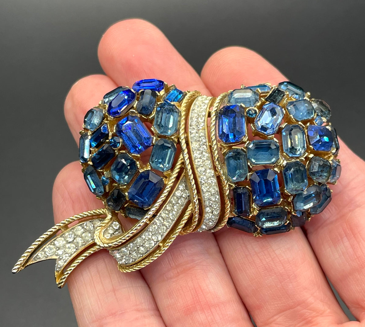 Vintage signed Trifari blue and clear rhinestone brooch in gold tone, a heavy, good quality example