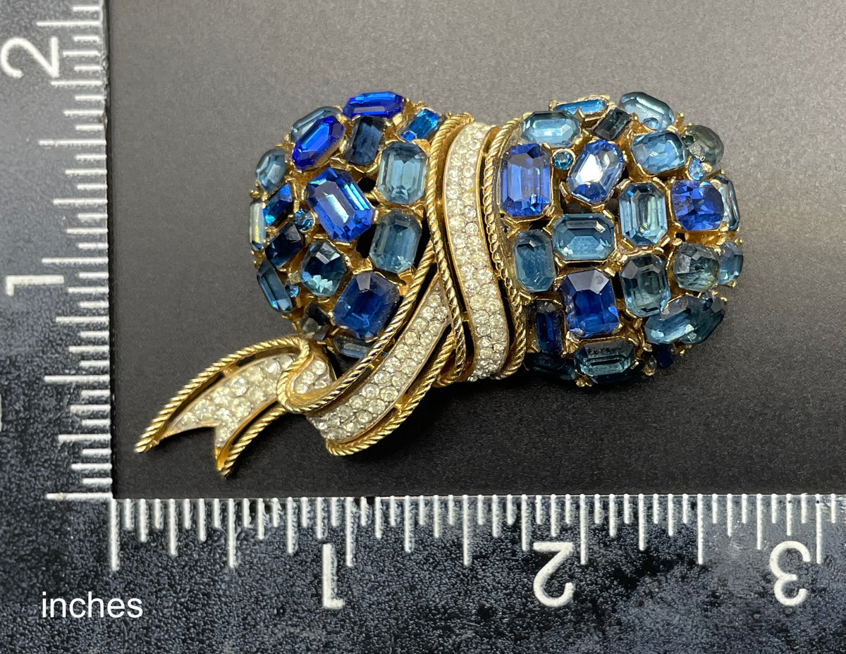 Vintage signed Trifari blue and clear rhinestone brooch in gold tone, a heavy, good quality example