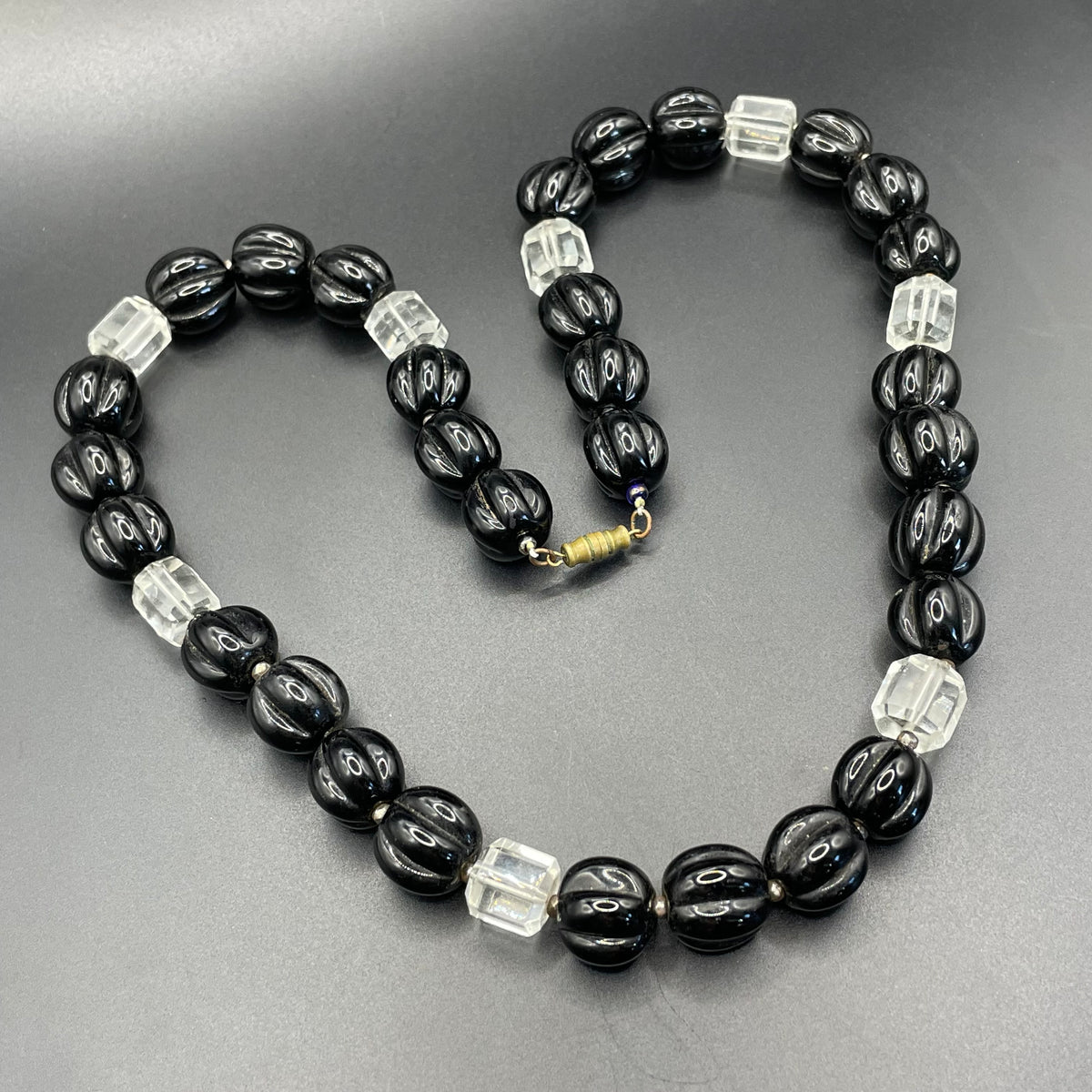 Vintage Art Deco chunky clear crystal faceted bead and carved black glass melon / pumpkin bead necklace, heavy poured glass, longer length