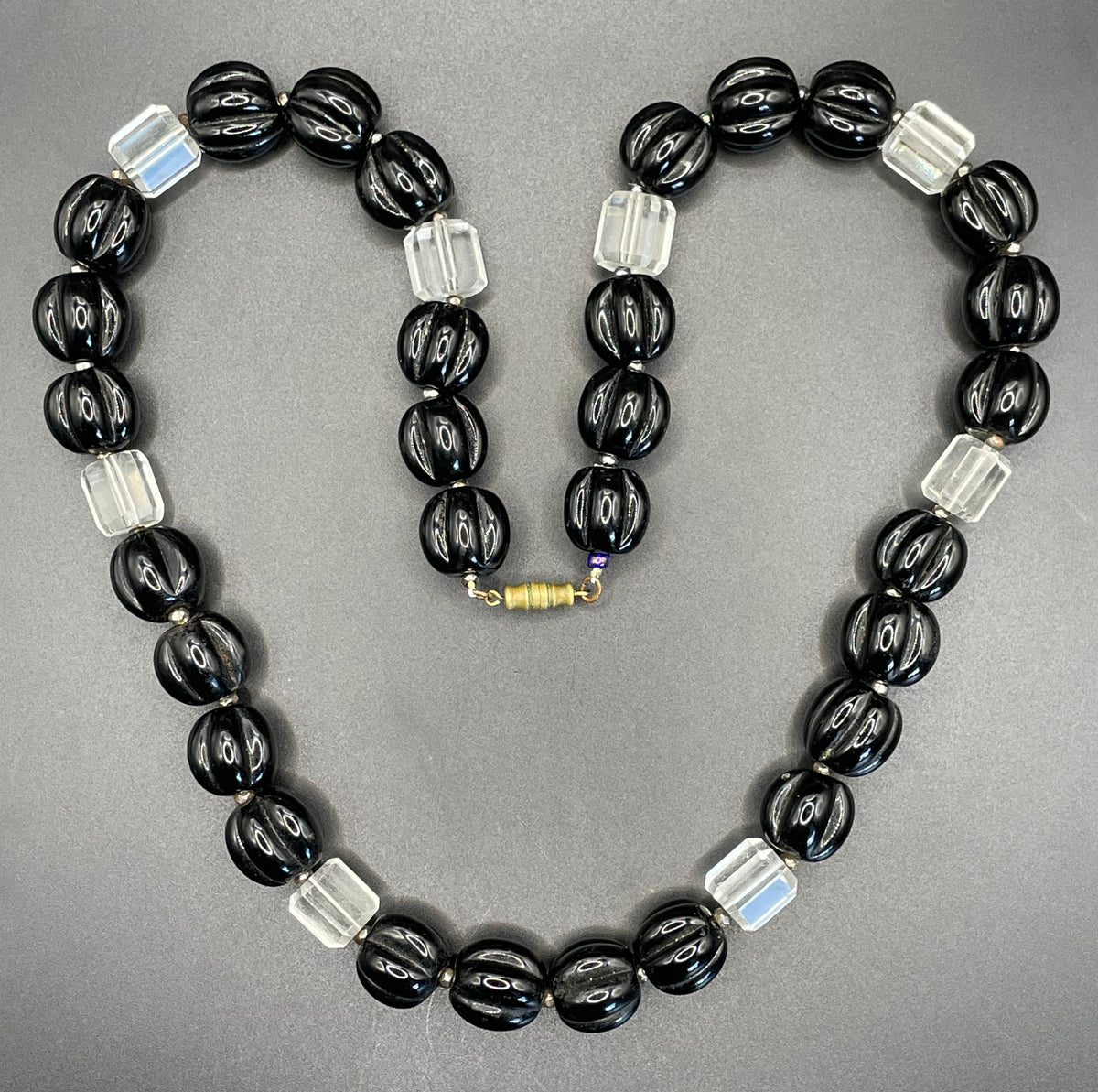 Vintage Art Deco chunky clear crystal faceted bead and carved black glass melon / pumpkin bead necklace, heavy poured glass, longer length