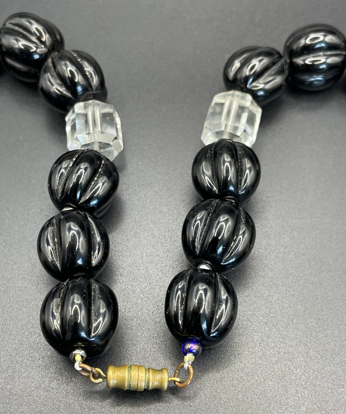 Vintage Art Deco chunky clear crystal faceted bead and carved black glass melon / pumpkin bead necklace, heavy poured glass, longer length