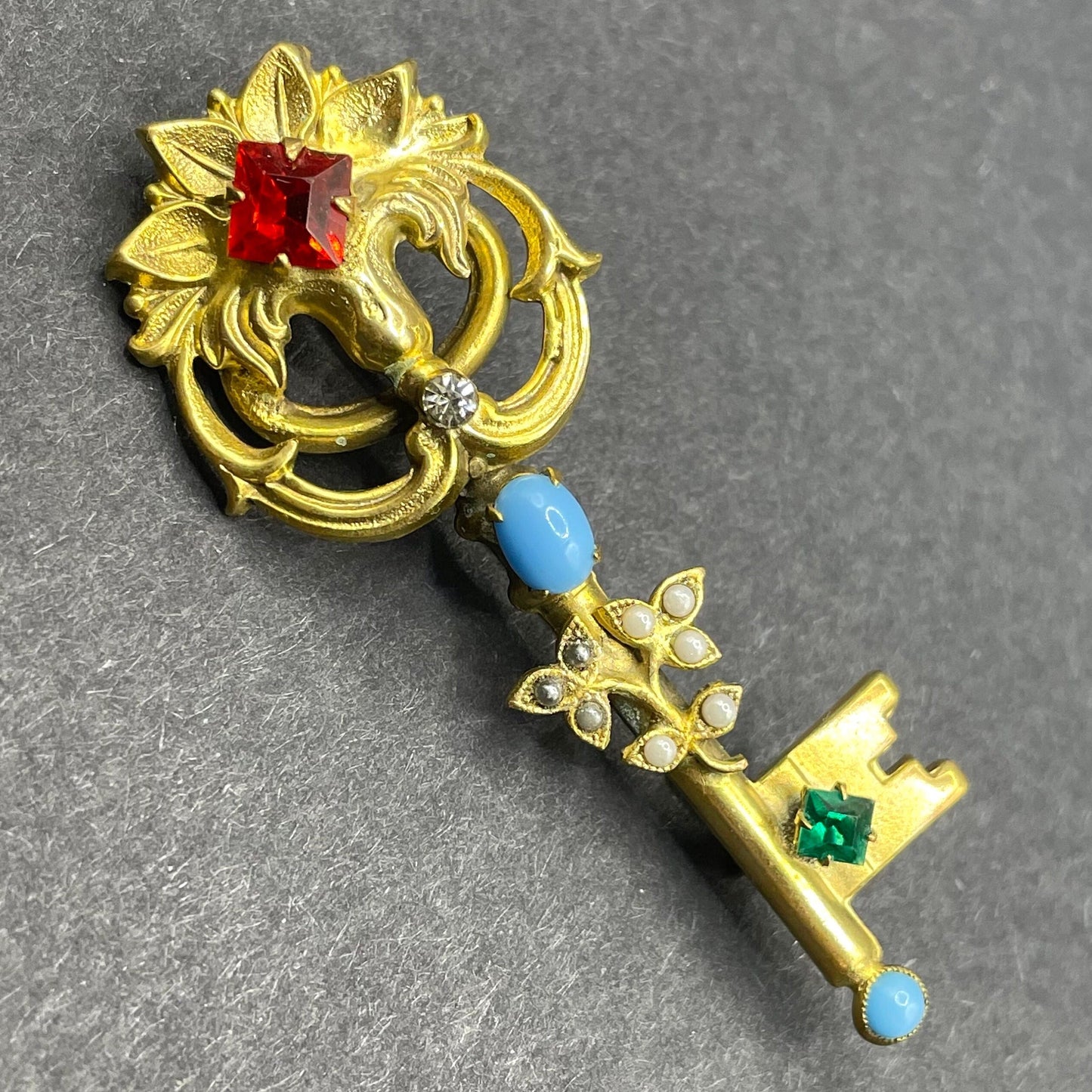 Vintage key brooch, gold tone, white and black glass pearls, red and green rhinestones and turquoise glass cabochons, old presentation box