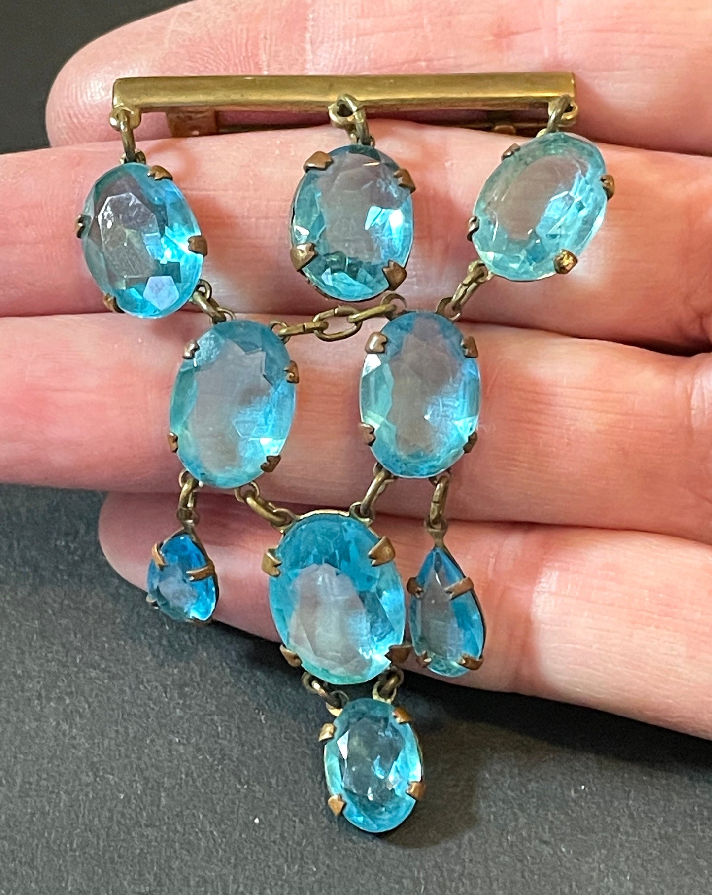 Vintage Art Deco aqua blue paste festoon dangle brooch with bezel set, open backed aquamarine coloured crystals set in antique gold tone