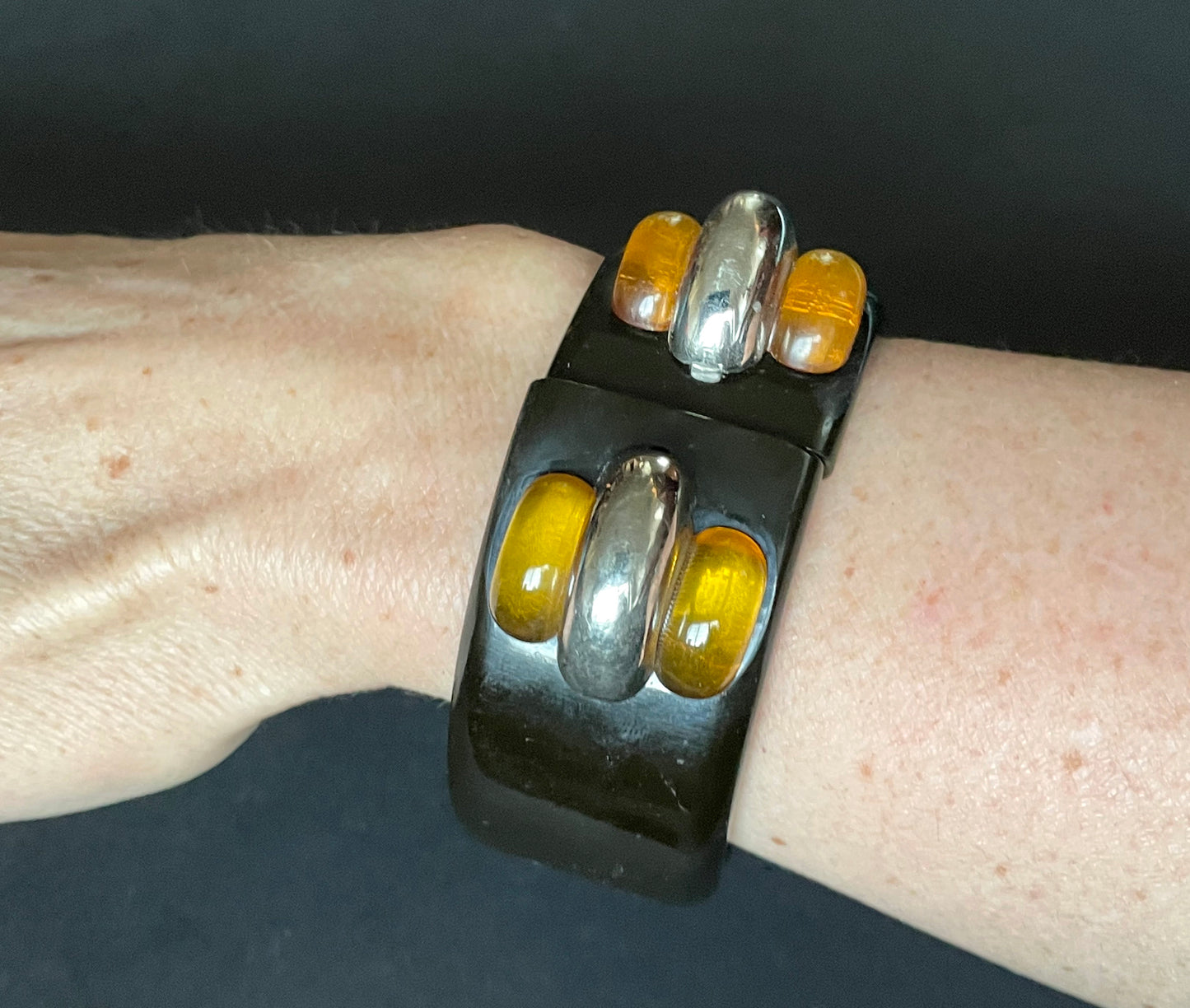 Vintage Bakelite Art Deco machine age geometric bangle with black and apple juice Bakelite and chromed accents