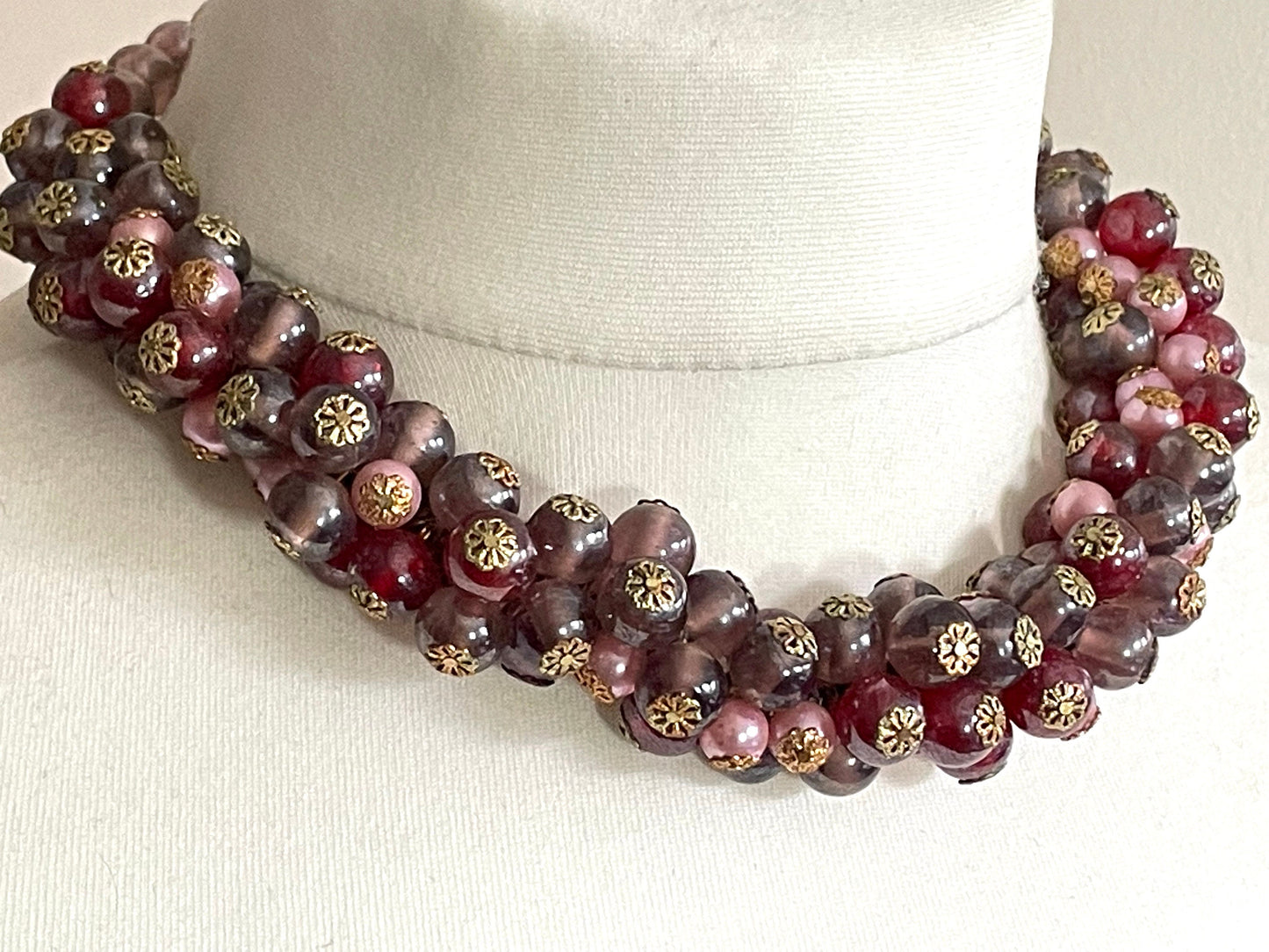 Heavy vintage pink, dark pink, purple and faux pearl glass bead cluster garland necklace with gold tone filigree bead caps and screw clasp