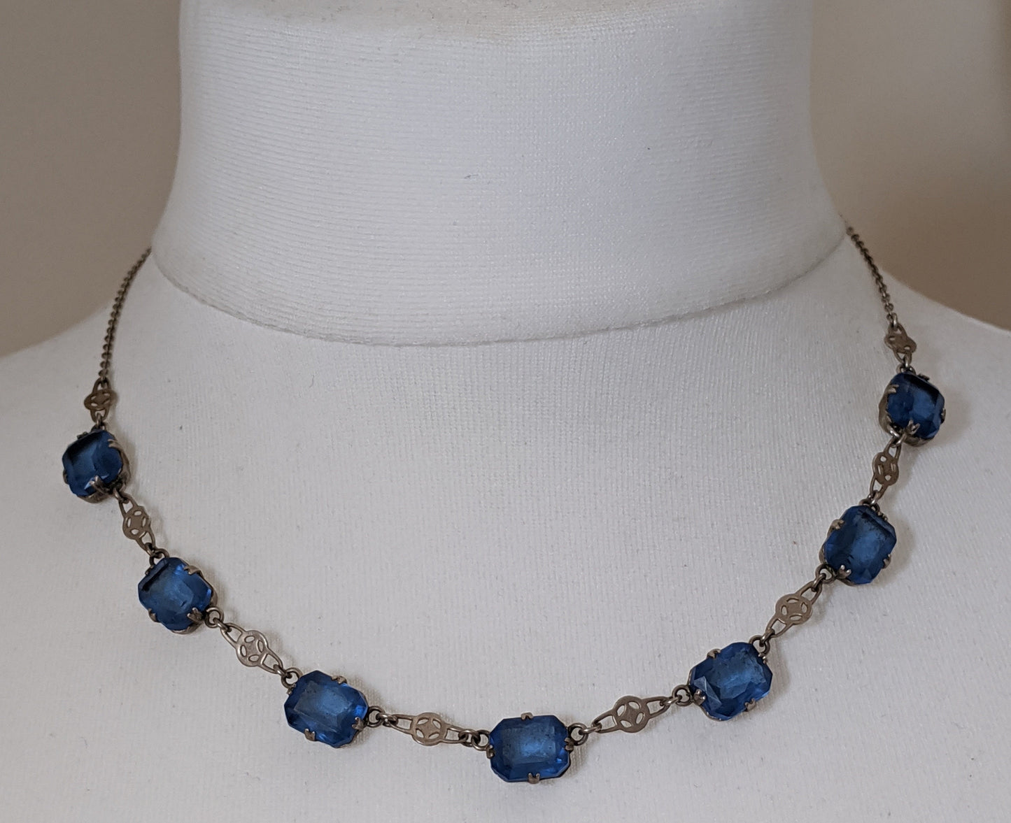 Vintage Art Deco Czech sapphire blue crystal paste and silver tone necklace, claw set open backed rhinestones, large baguette cut stones