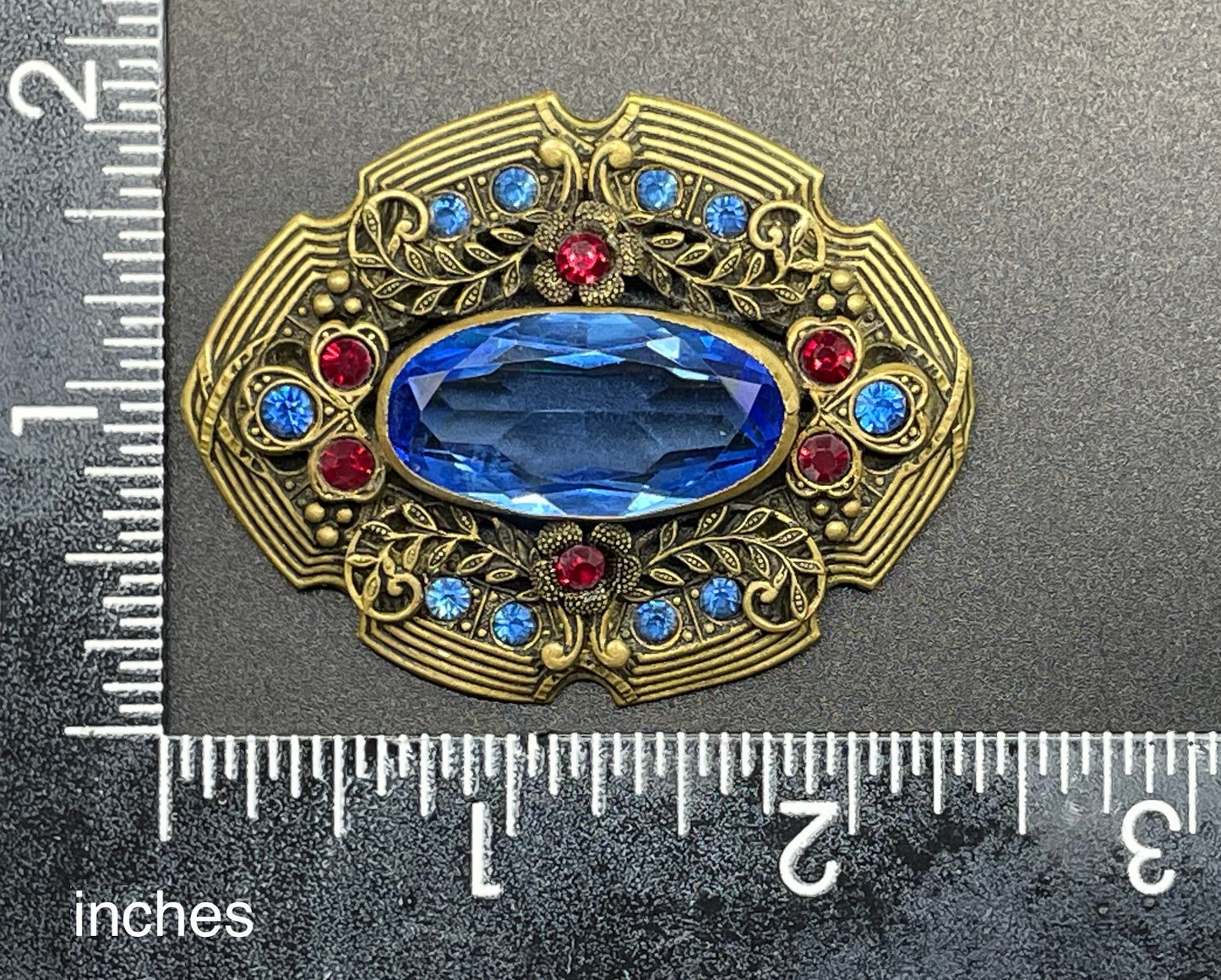 Large vintage Art Deco sapphire blue and bright ruby red rhinestone and ornate gold tone floral design Czech brooch, Neiger style