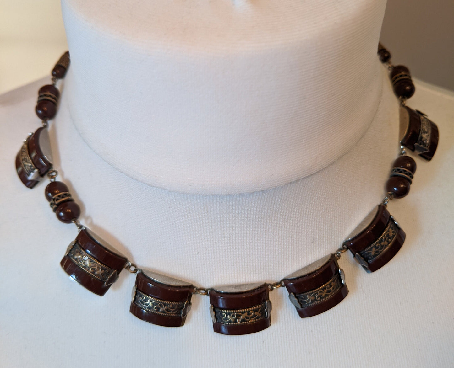 Vintage Art Deco machine age chrome, burgundy / brown glass geometric necklace with filigree detail