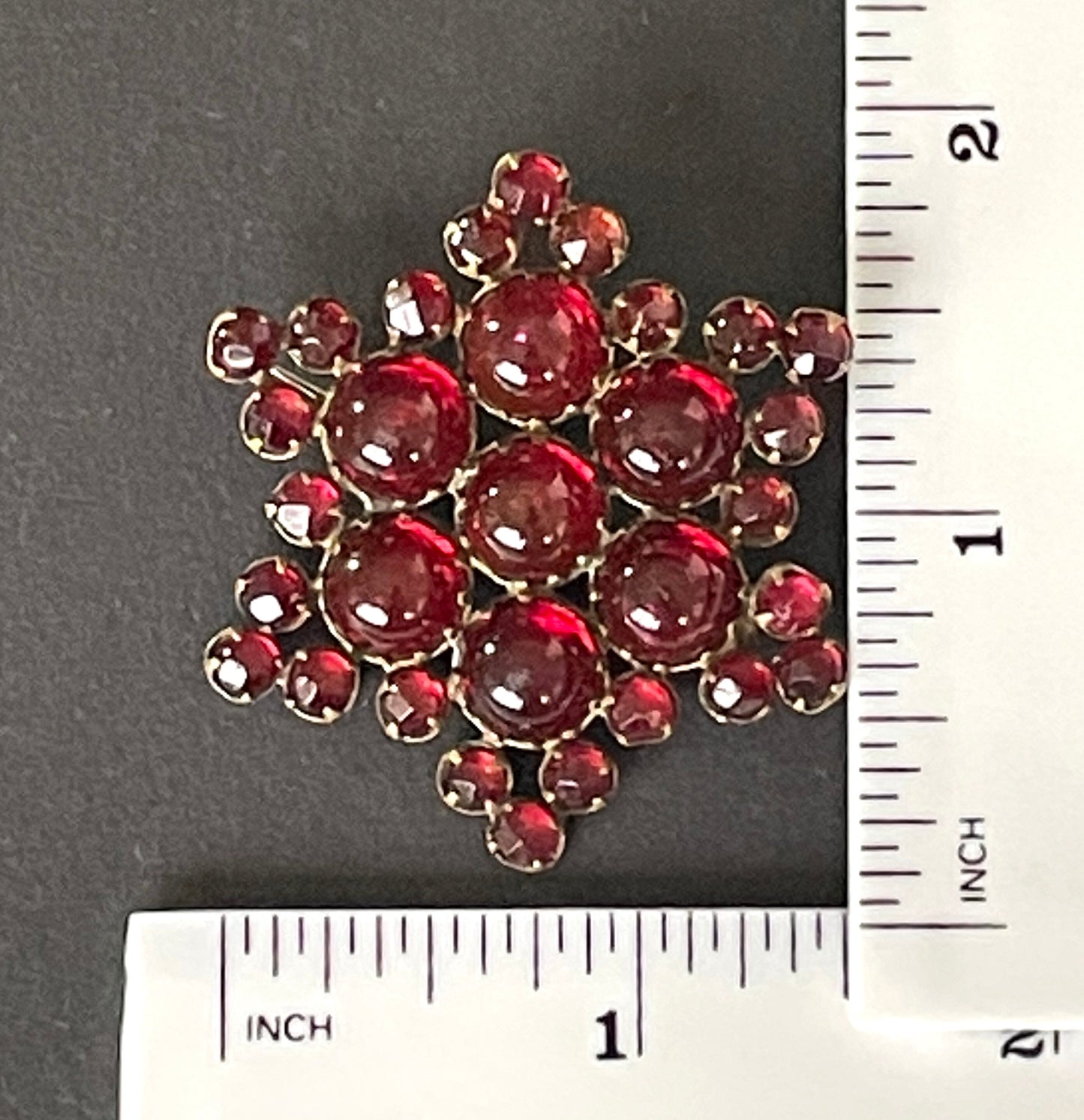 Vintage / antique Bohemian garnet star brooch, rose cut stones and cabochons set in yellow metal possibly gold, Victorian