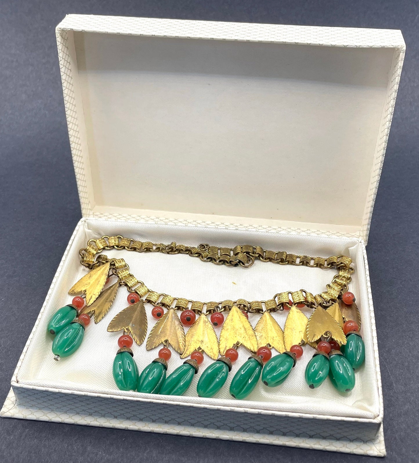 Vintage early Miriam Haskell jade green and orange poured glass beaded and gold tone Egyptian revival fringe necklace with book chain links