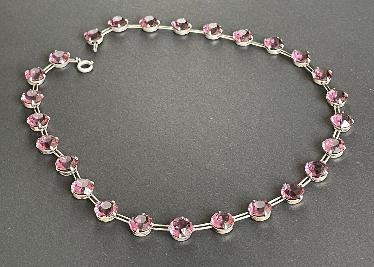 Vintage sterling silver Art Deco ruby pink / amethyst purple chaton cut crystal rhinestone riviere necklace bezel set, open backed