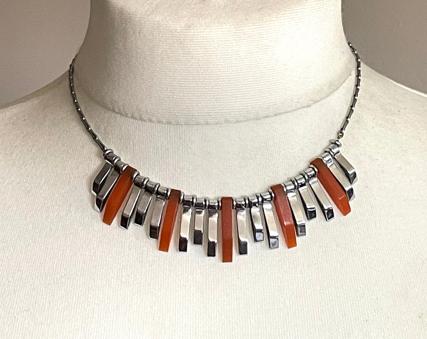 Vintage Jakob Bengel Art Deco machine age necklace, beautiful bright orange galalith 3D geometric shapes with shiny silver tone chrome