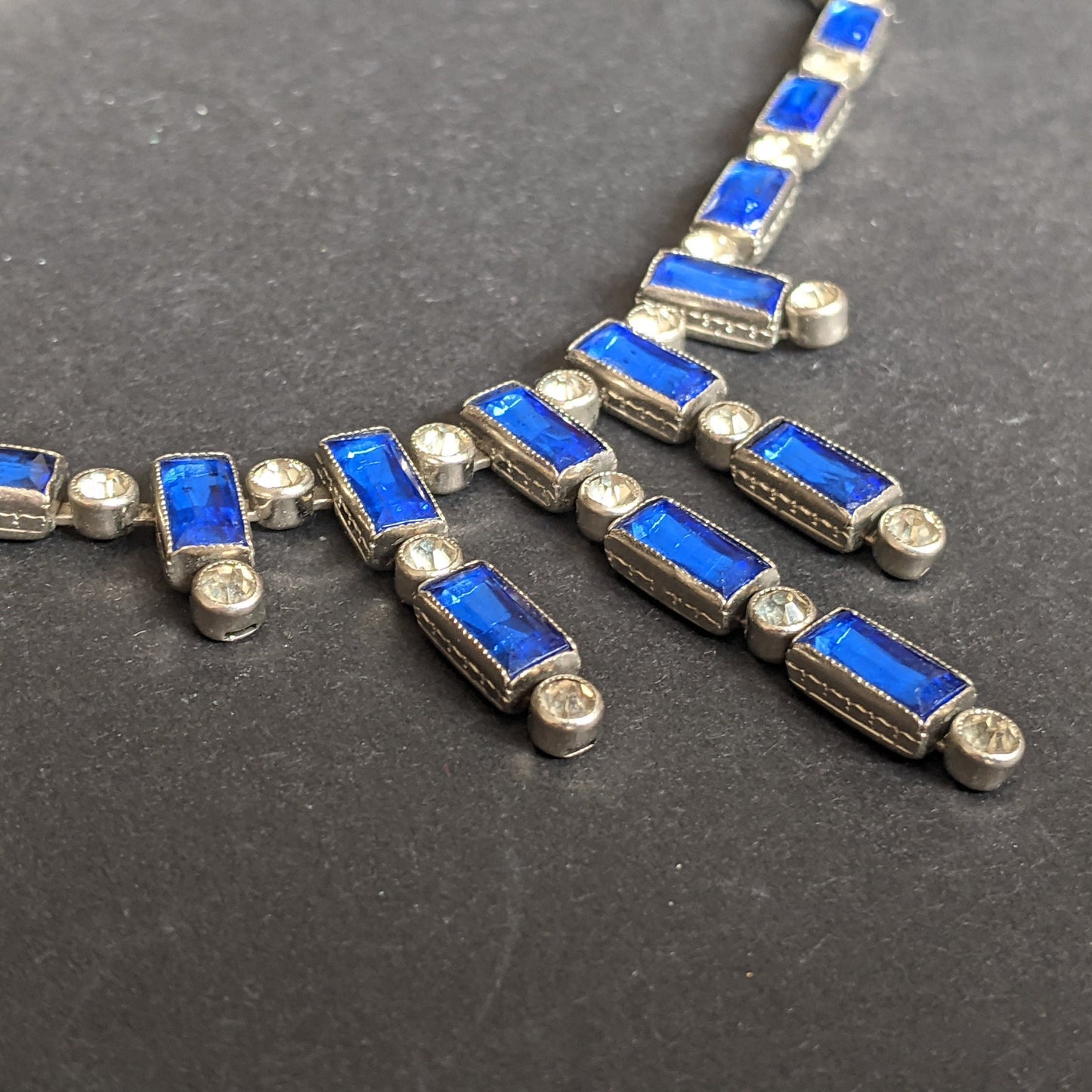 Vintage / antique Bristol blue and clear paste collet set crystal, silver plated riviere necklace with baguette stones and central fringe