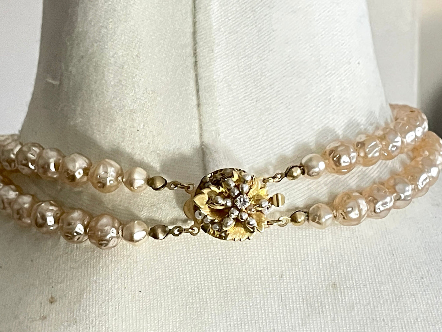 Vintage Miriam Haskell pale pink dimpled baroque pearl double strand necklace with ornate centrepiece and box clasp