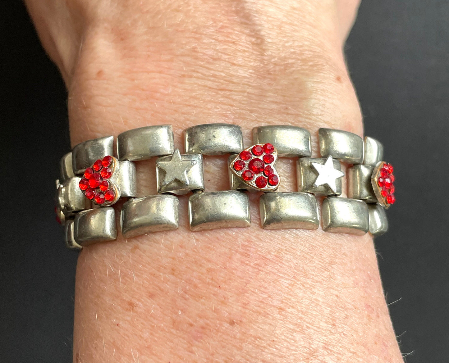 Vintage signed Askew London red rhinestone heart and star tank track panel bracelet in antique silver tone