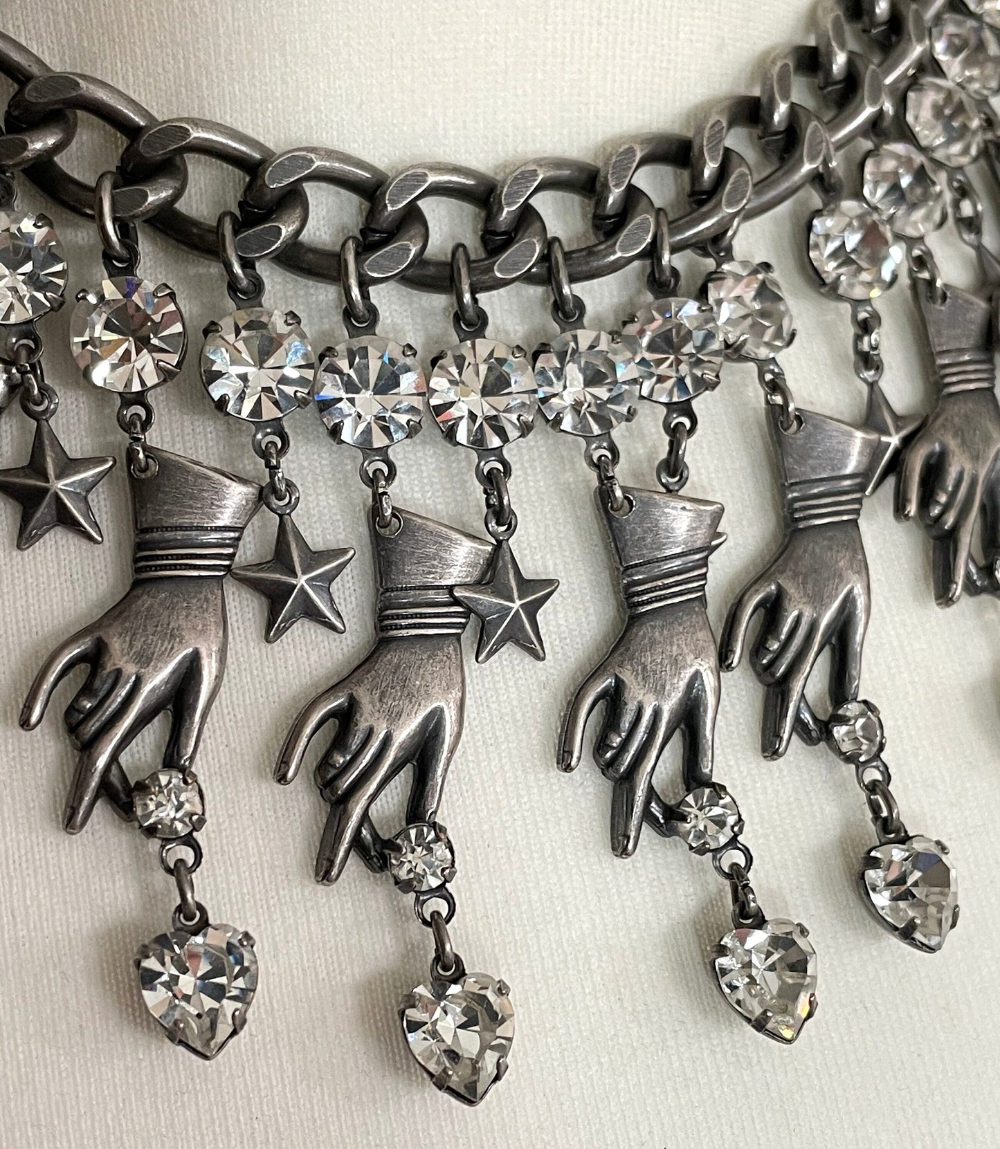 Vintage early Askew London hand, heart and star heavy fringe necklace, statement piece in chic dark silver tone & clear rhinestone, unique