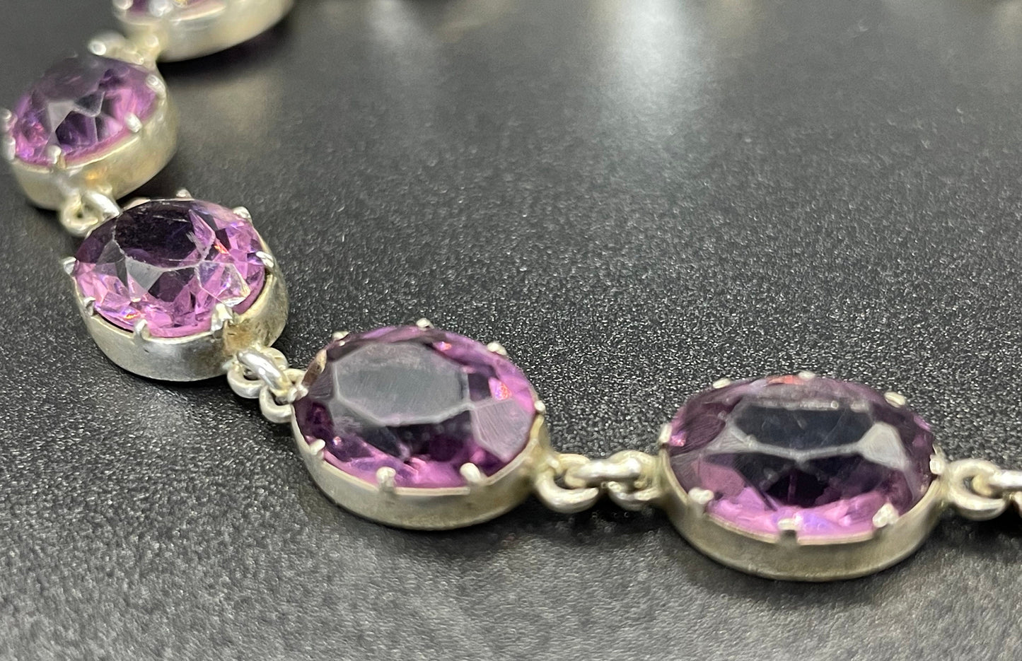 Antique fine sterling silver and amethyst paste collet set riviere style bracelet, bezel set, open backed large, oval purple stones, in box