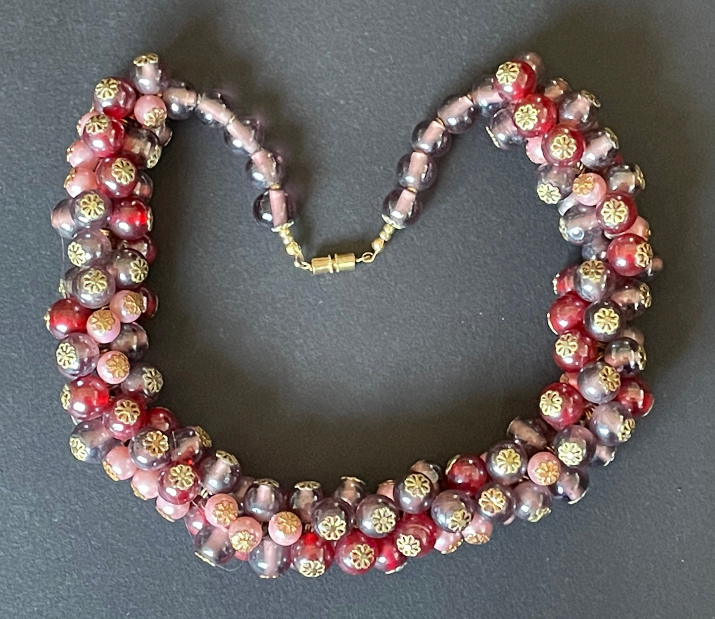 Heavy vintage pink, dark pink, purple and faux pearl glass bead cluster garland necklace with gold tone filigree bead caps and screw clasp