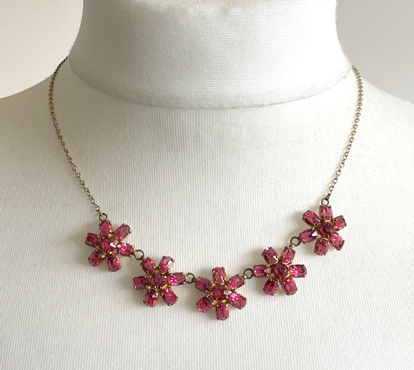 Vintage crystal floral design pink ruby coloured rhinestone necklace and earrings set- bright rhinestones set open-backed in gold tone