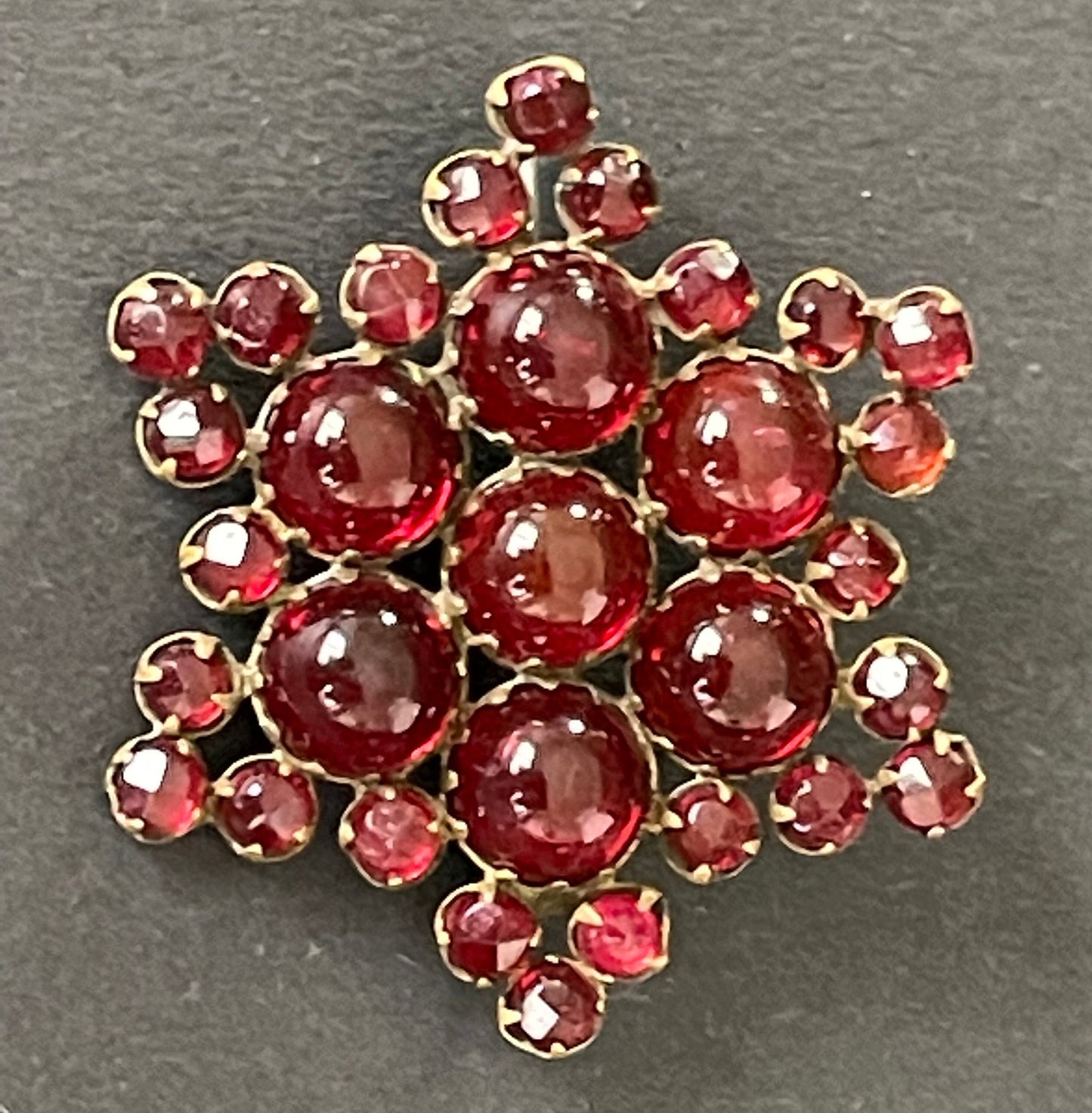 Vintage / antique Bohemian garnet star brooch, rose cut stones and cabochons set in yellow metal possibly gold, Victorian