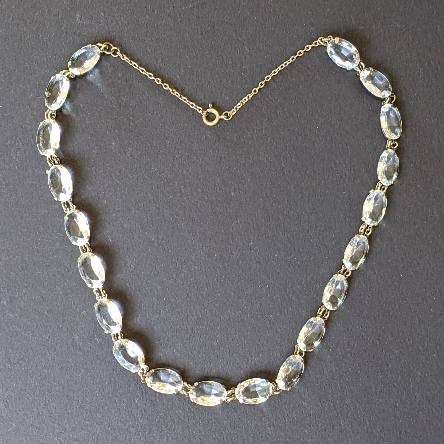 Vintage Art Deco clear paste large oval crystal riviere necklace, bezel set open backed Czech crystal stones set in gold tone