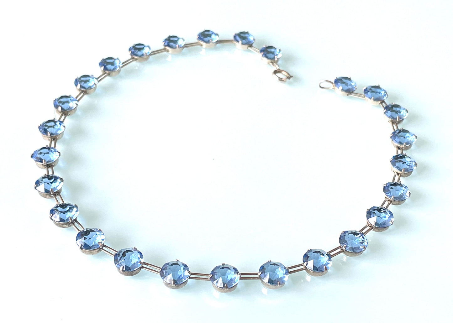 Vintage sterling silver Art Deco sapphire blue chaton cut crystal rhinestone riviere necklace bezel set, open backed