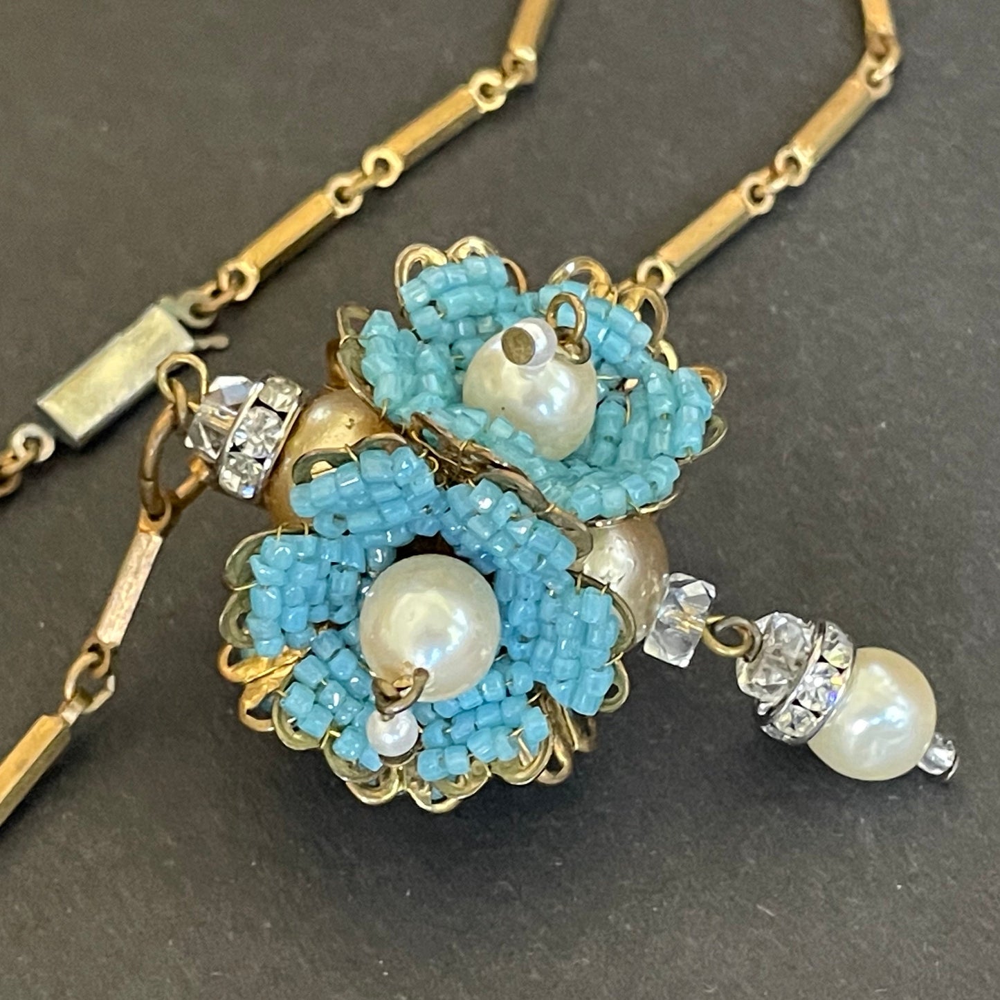 Vintage Miriam Haskell elaborate glass beaded floral  long pendant necklace with intricate turquoise blue micro beading and white faux pearl