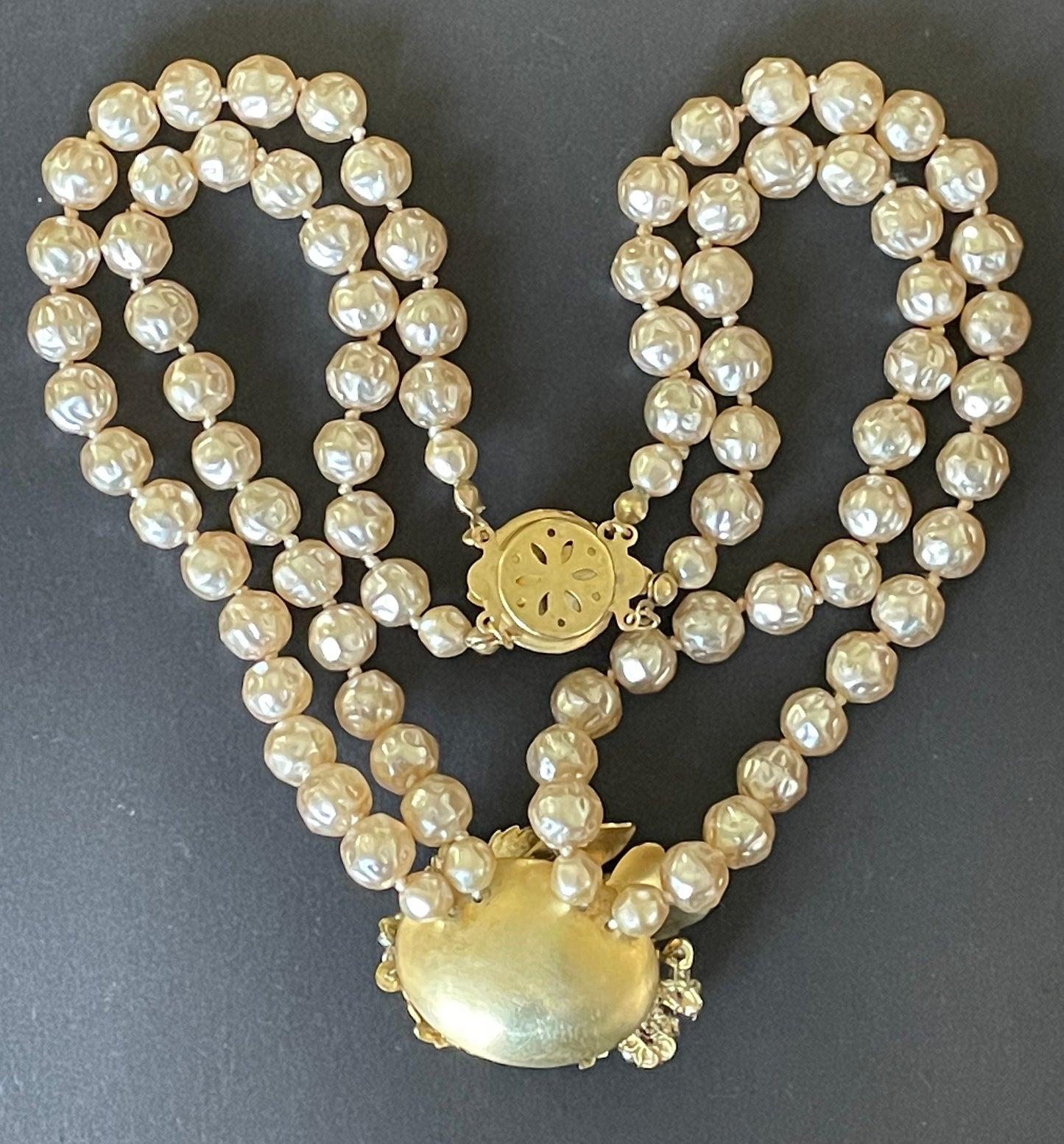 Vintage Miriam Haskell pale pink dimpled baroque pearl double strand necklace with ornate centrepiece and box clasp