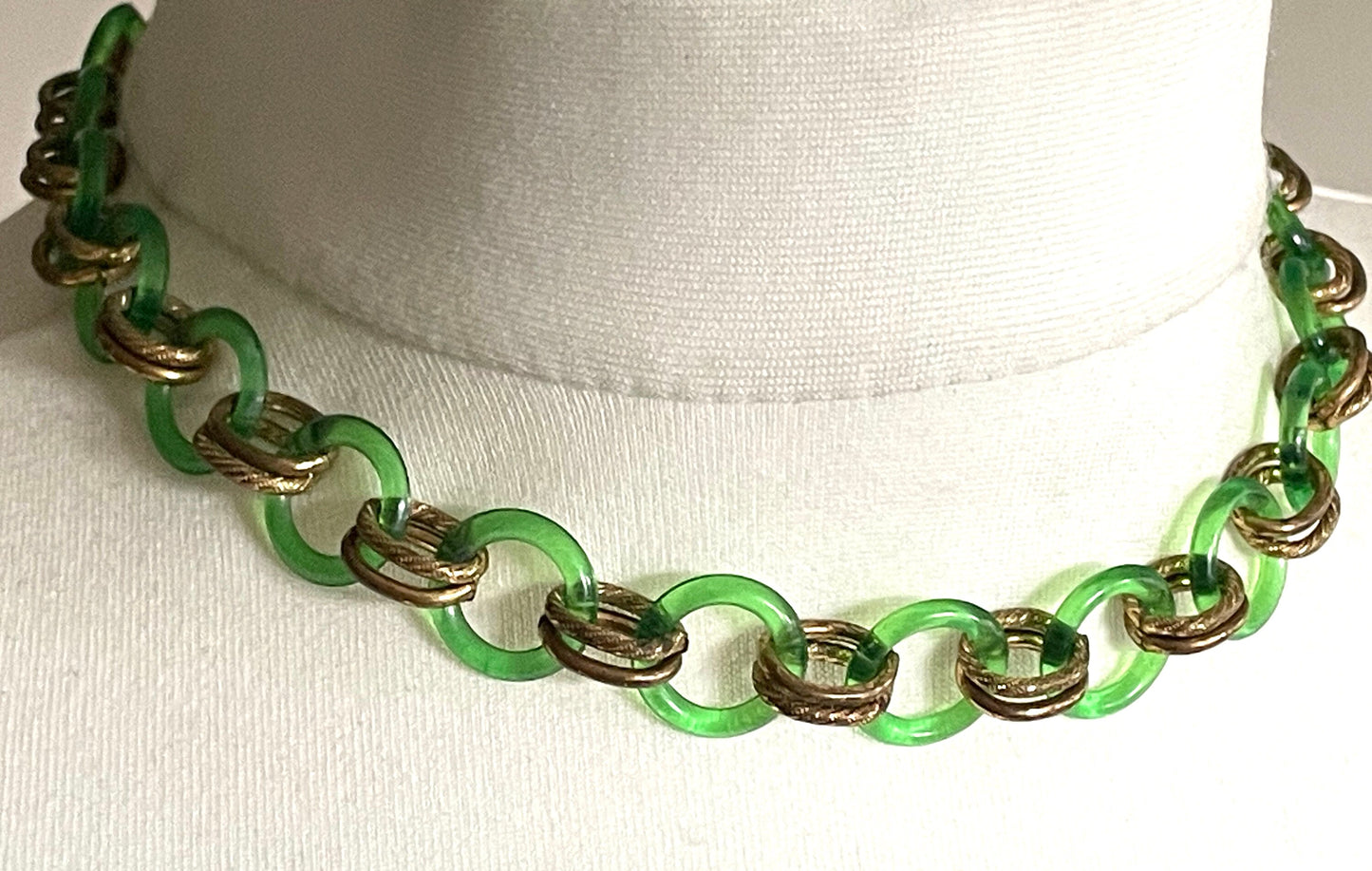 Vintage Jakob Bengel Art Deco 1930s machine age collar necklace with early plastic transparent green circles, antique gold tone links