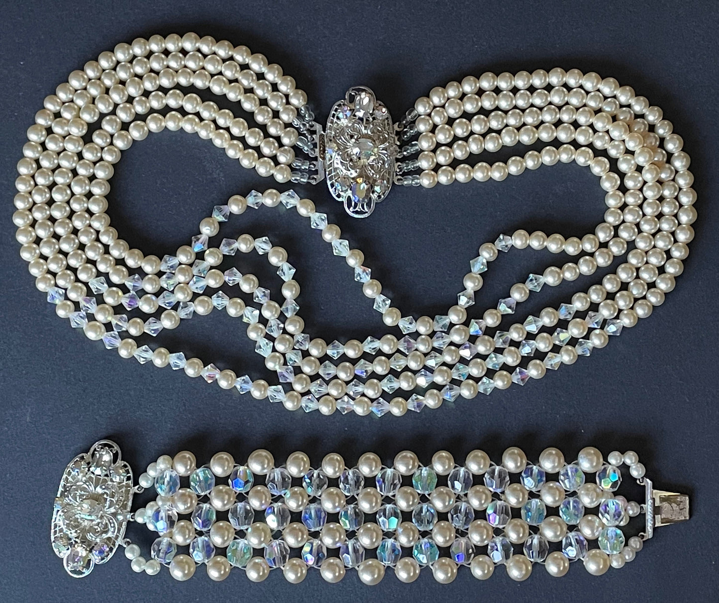 Vintage multi five strand glass faux pearl and crystal bead necklace and matching bracelet, each with large ornate rhinestone box clasp