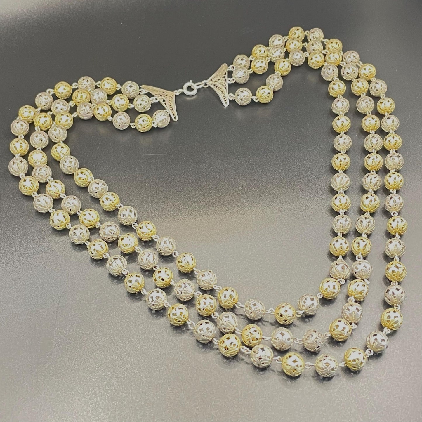 Antique sterling silver (tested) filigree bead, triple stranded necklace - gorgeous alternating silver and gold vermeil beads, 76 grams