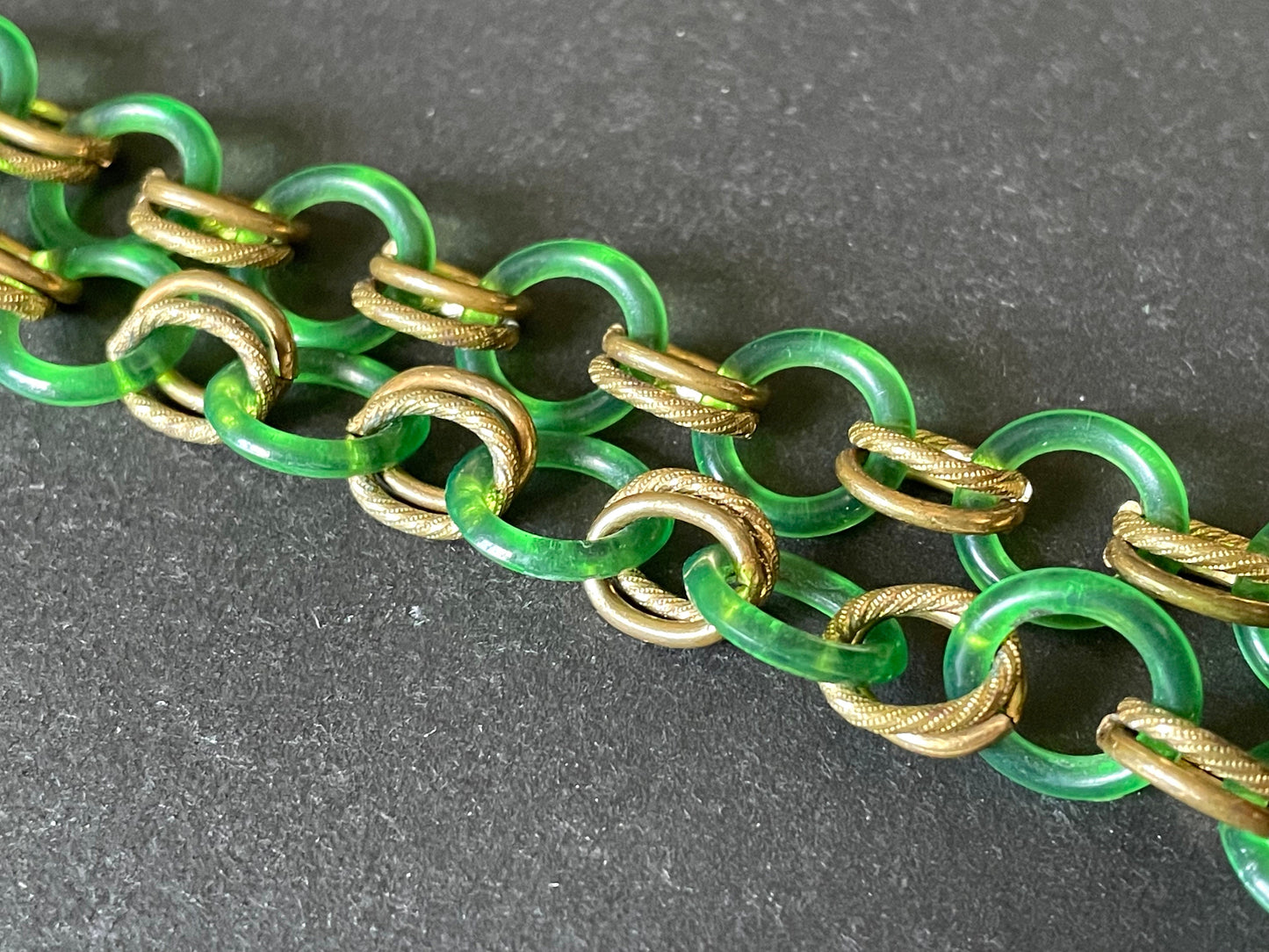 Vintage Jakob Bengel Art Deco 1930s machine age collar necklace with early plastic transparent green circles, antique gold tone links