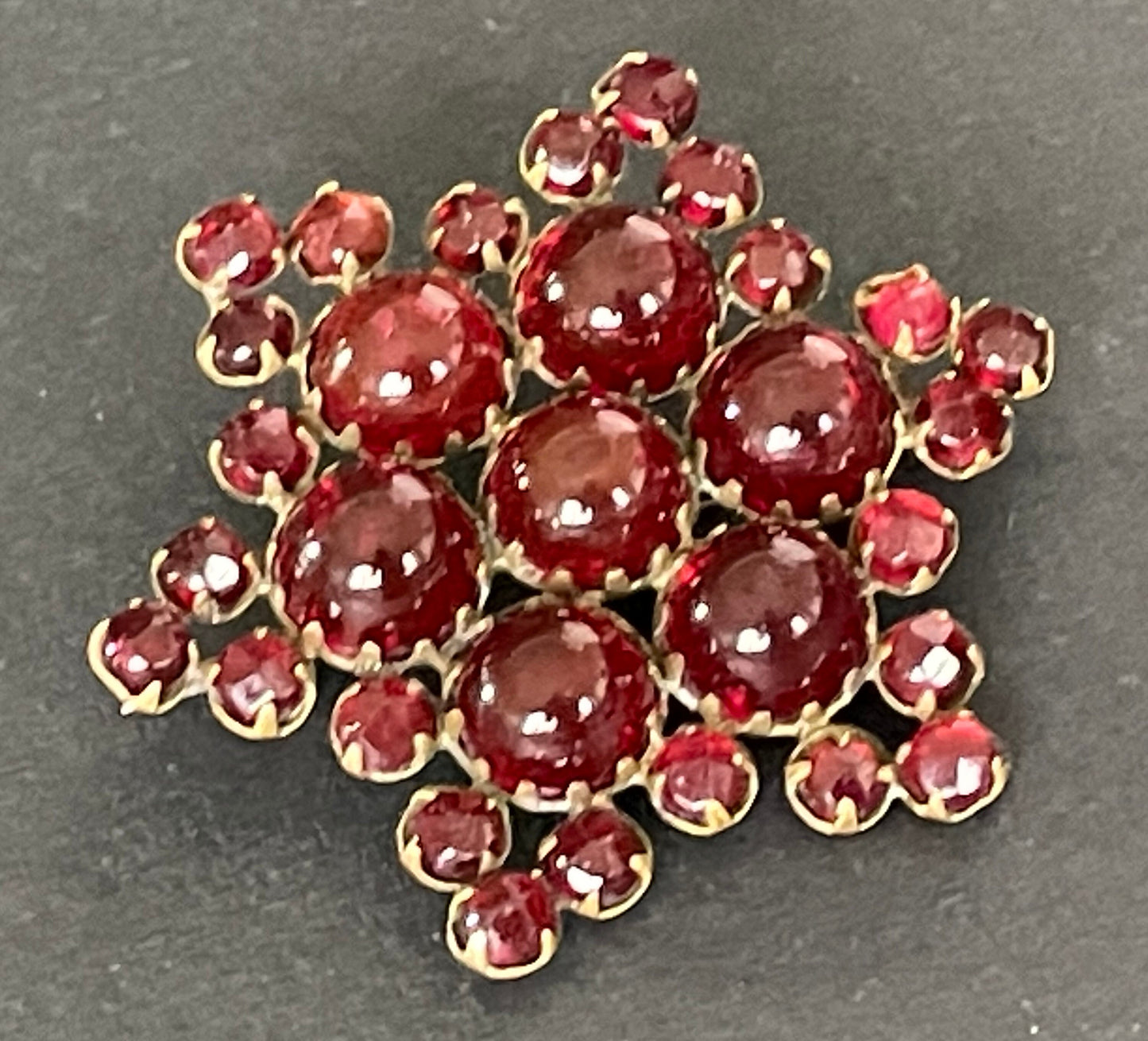 Vintage / antique Bohemian garnet star brooch, rose cut stones and cabochons set in yellow metal possibly gold, Victorian