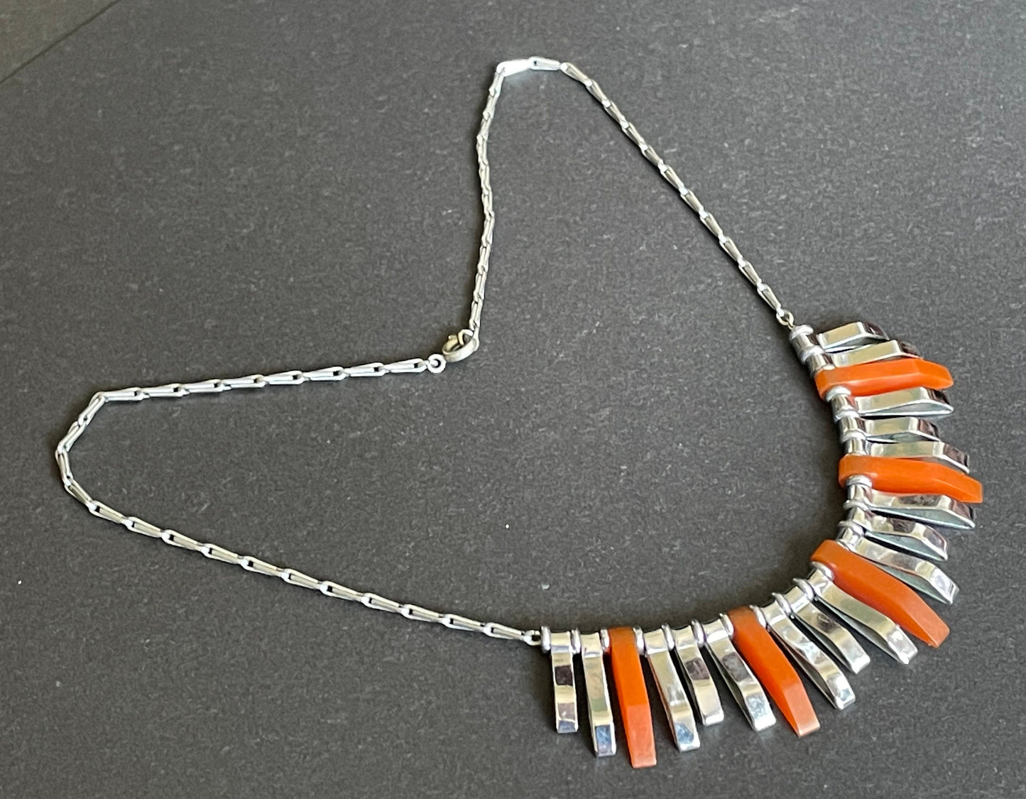 Vintage Jakob Bengel Art Deco machine age necklace, beautiful bright orange galalith 3D geometric shapes with shiny silver tone chrome