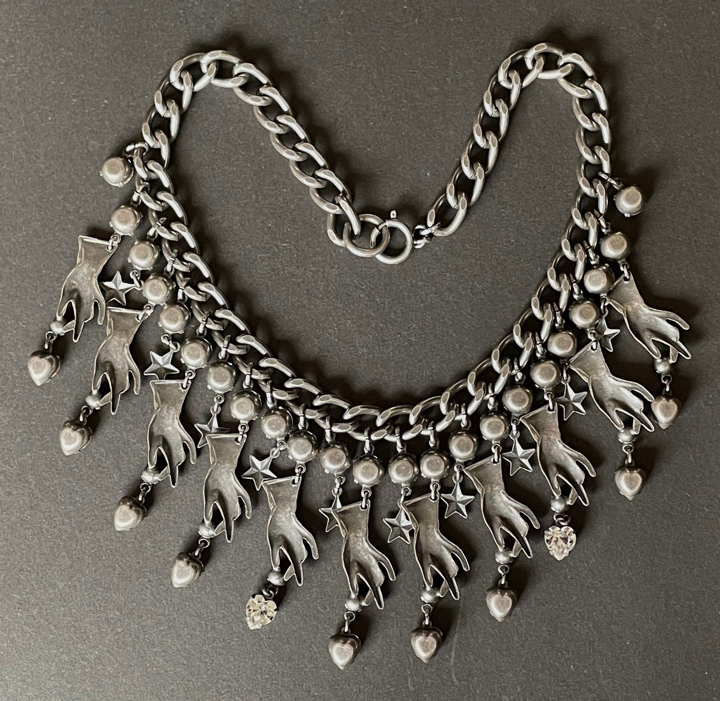 Vintage early Askew London hand, heart and star heavy fringe necklace, statement piece in chic dark silver tone & clear rhinestone, unique