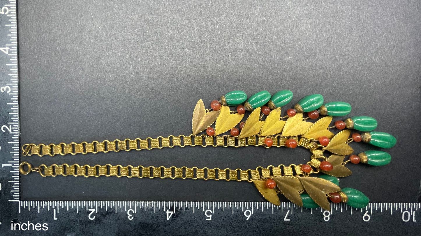 Vintage early Miriam Haskell jade green and orange poured glass beaded and gold tone Egyptian revival fringe necklace with book chain links