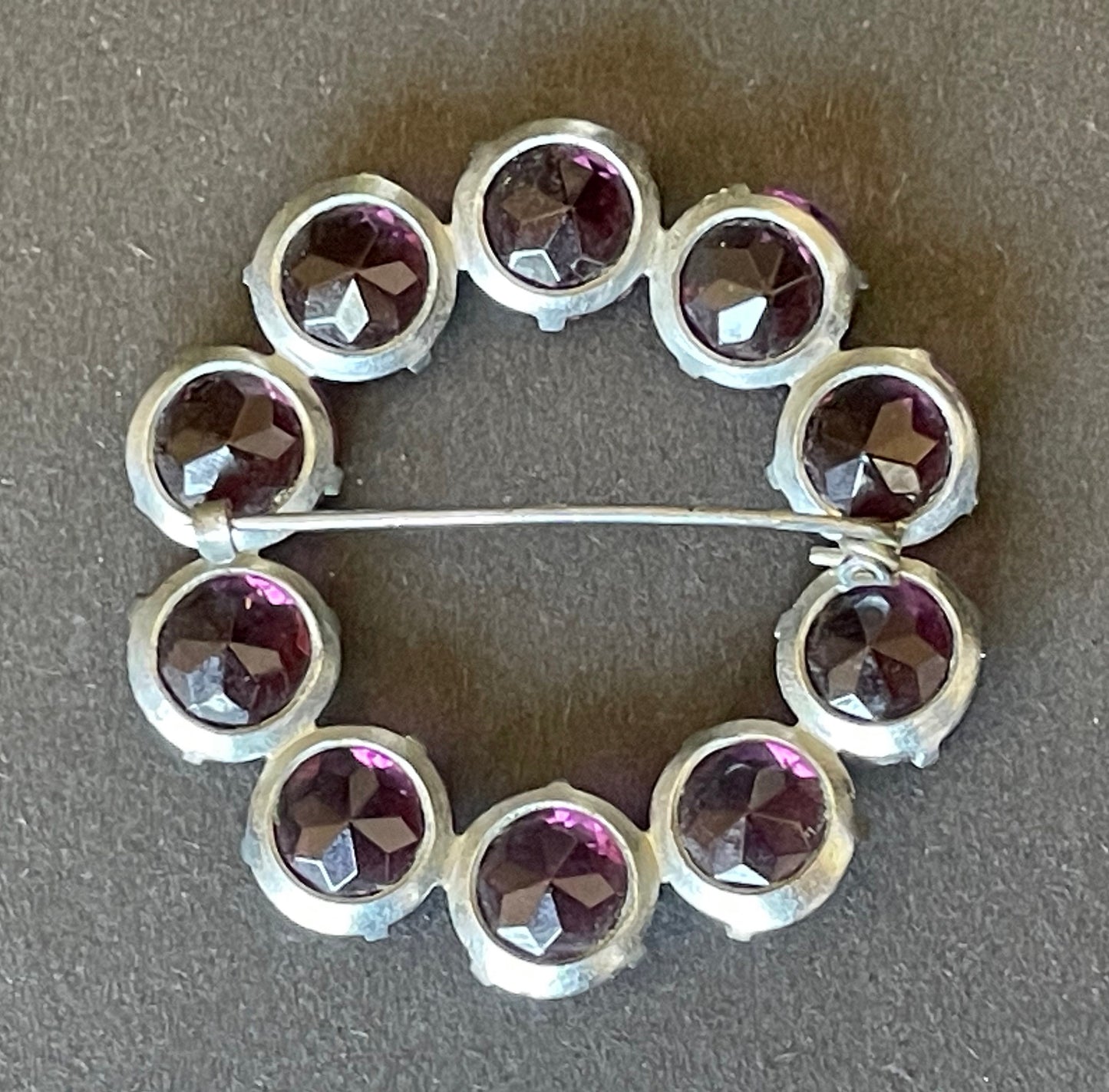 Vintage Art Deco bezel set gorgeous vibrant amethyst purple crystal riviere circle brooch, open-backed rhinestones in silver tone