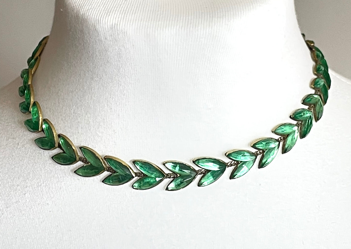 Vintage peridot green moulded Vauxhall style glass leaf design necklace, set in antique brassy gold tone