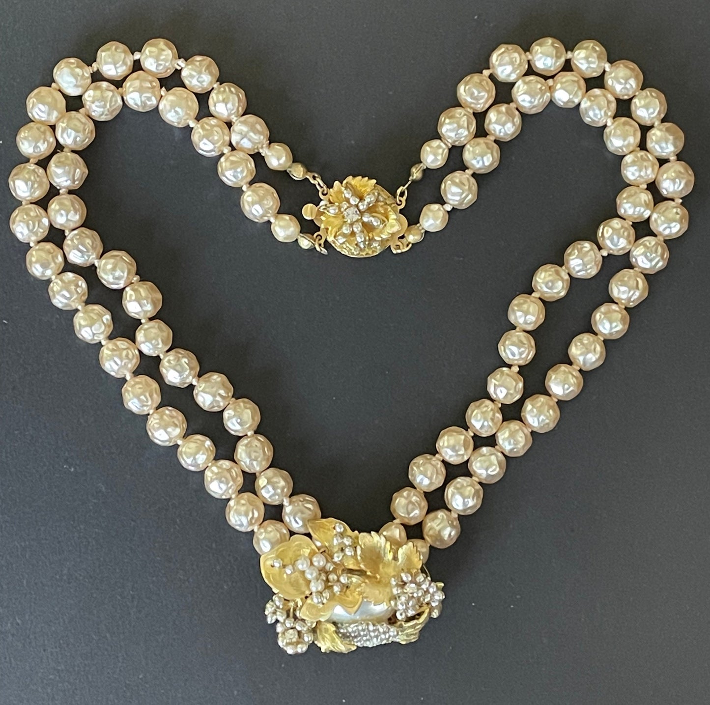 Vintage Miriam Haskell pale pink dimpled baroque pearl double strand necklace with ornate centrepiece and box clasp