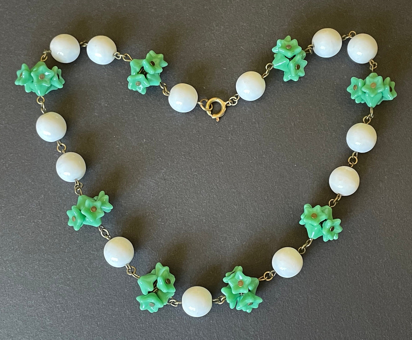 Vintage Art Deco green glass flower and large white milk glass bead, delicate glass necklace