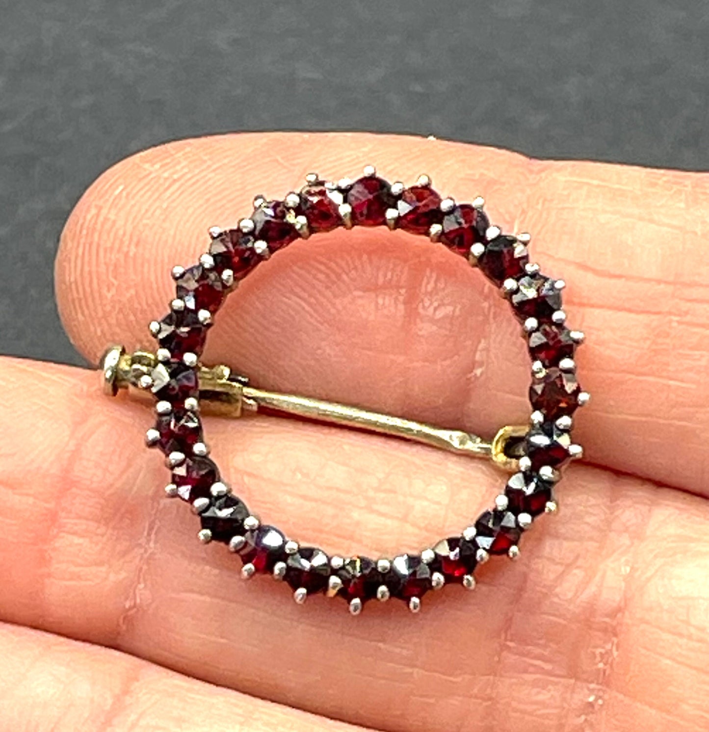 Petite vintage / antique Bohemian garnet circle brooch, rose cut stones set in hallmarked sterling silver gilt, trombone clasp