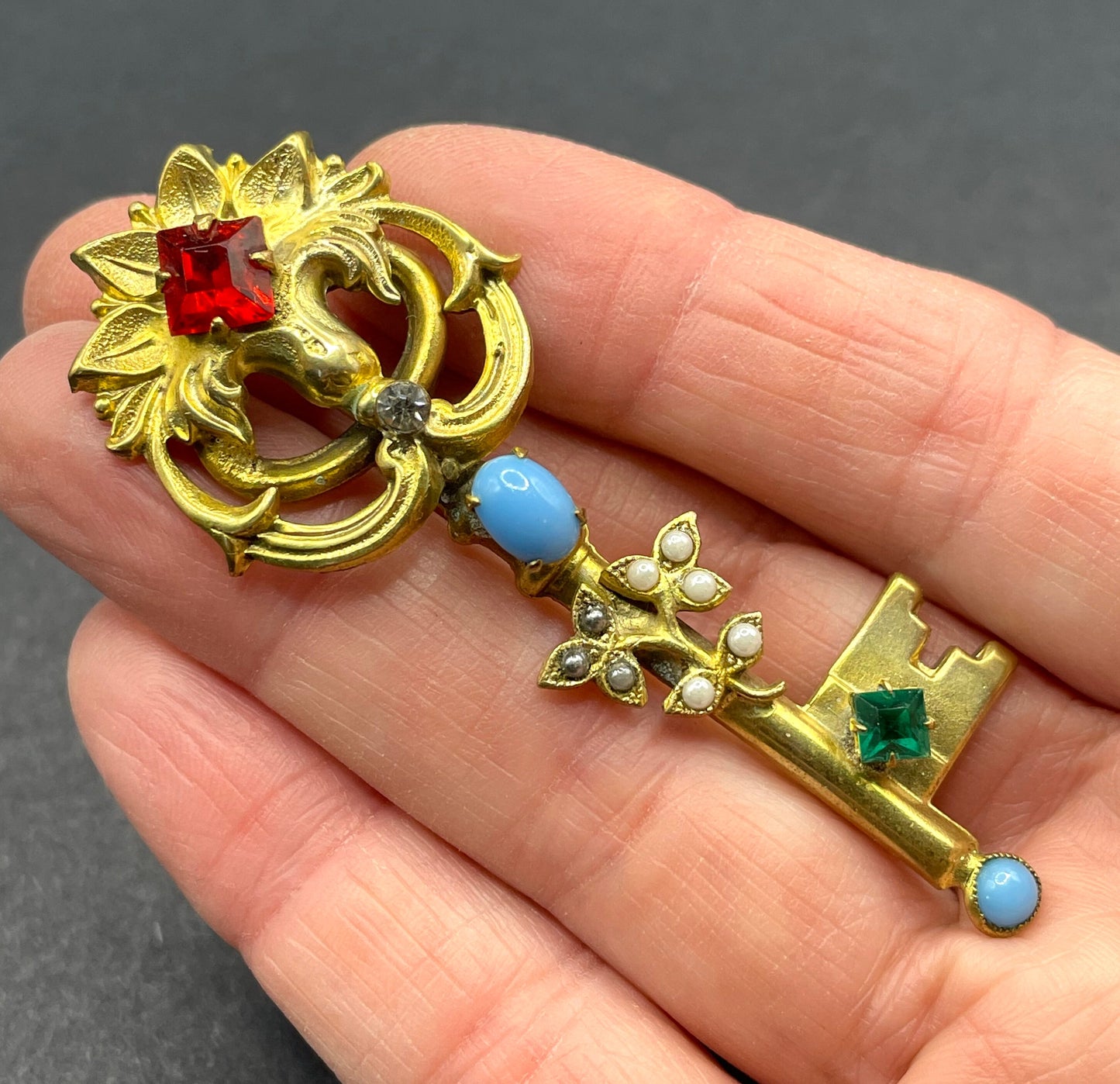 Vintage key brooch, gold tone, white and black glass pearls, red and green rhinestones and turquoise glass cabochons, old presentation box